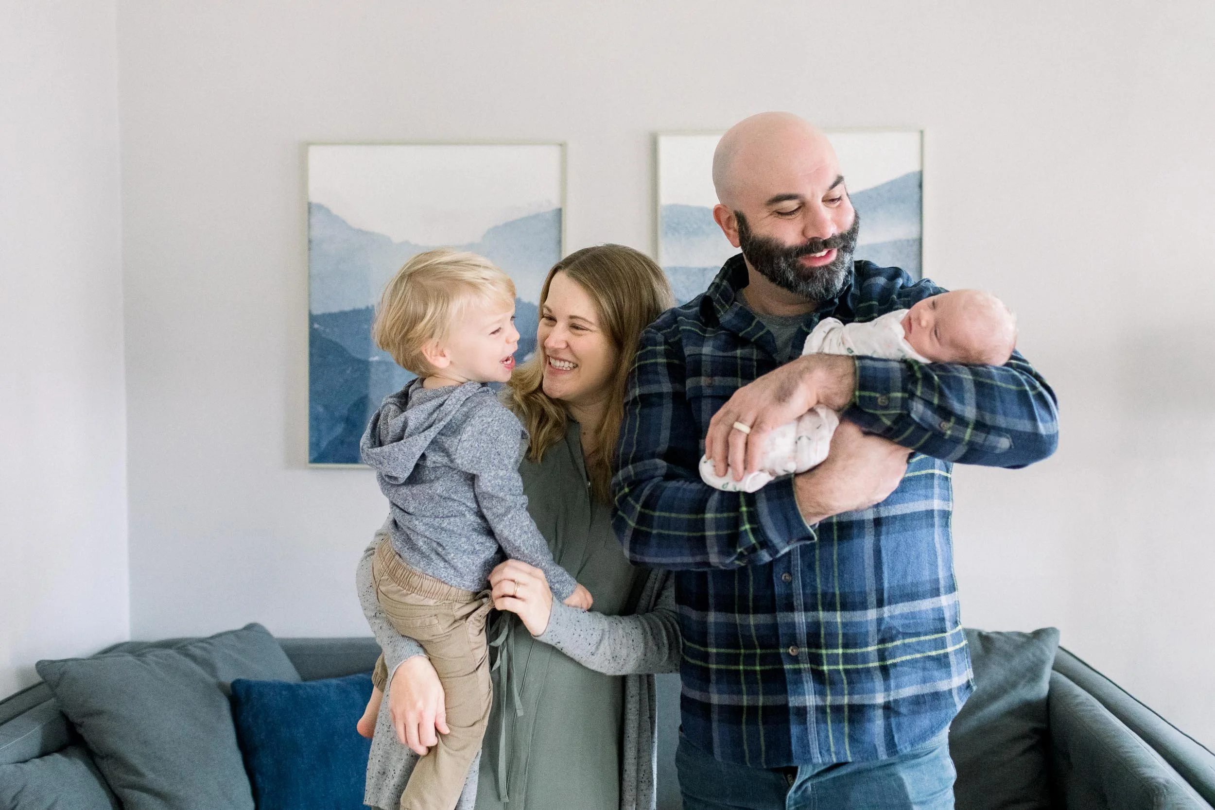 Family welcoming baby girl in their home