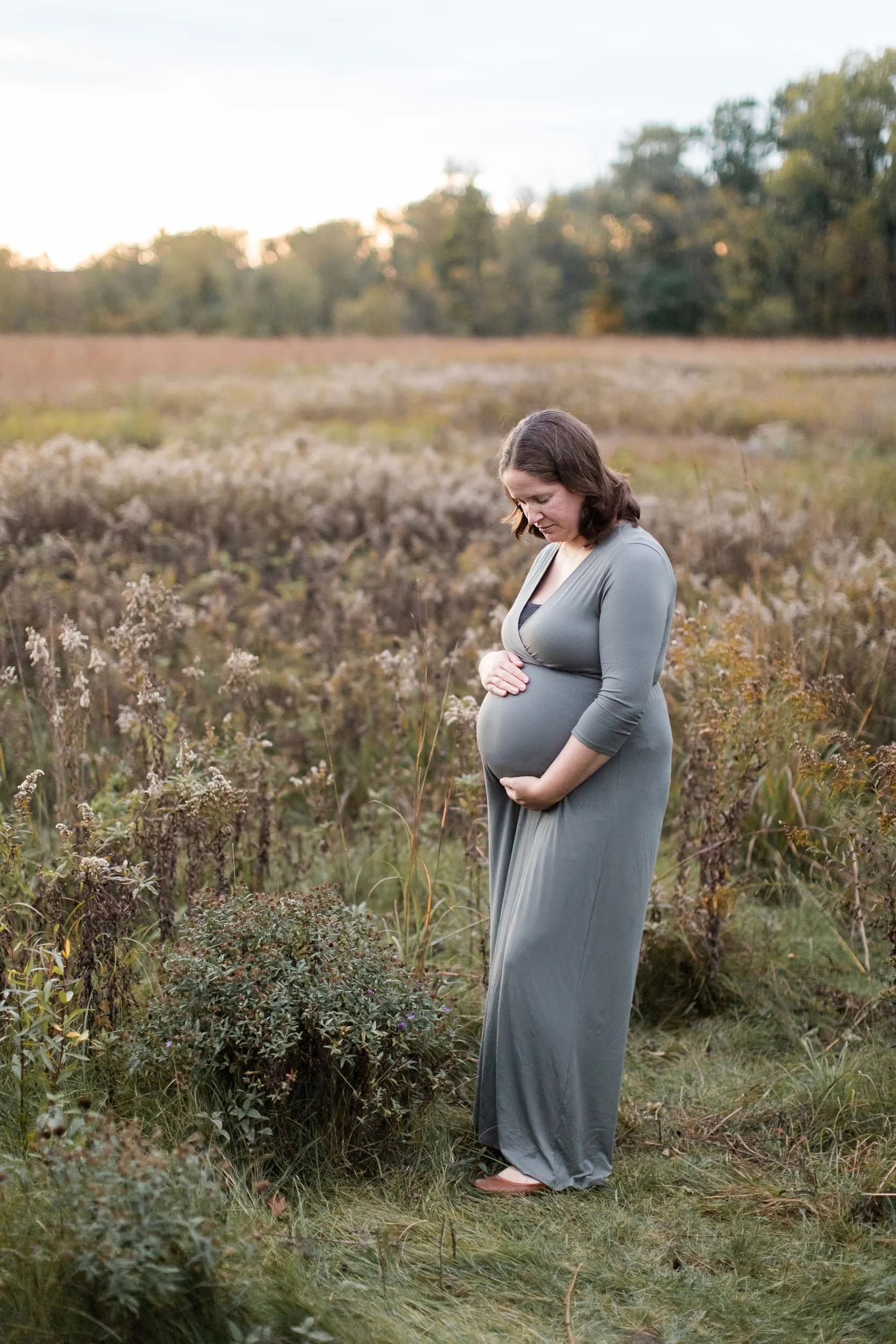 Maternity photography in a field of wildflowers