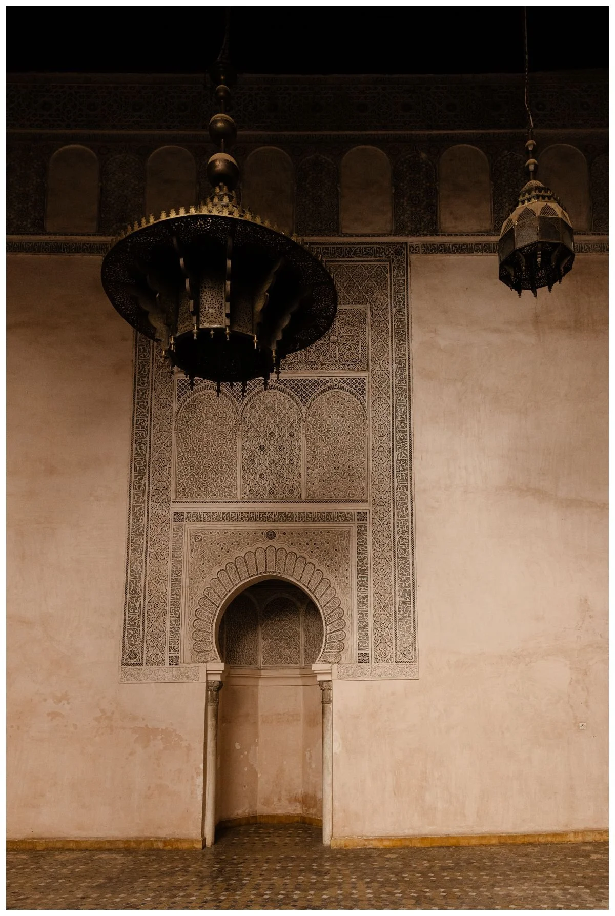 Traditional Moroccan door and and pendant chandeliers in Fez
