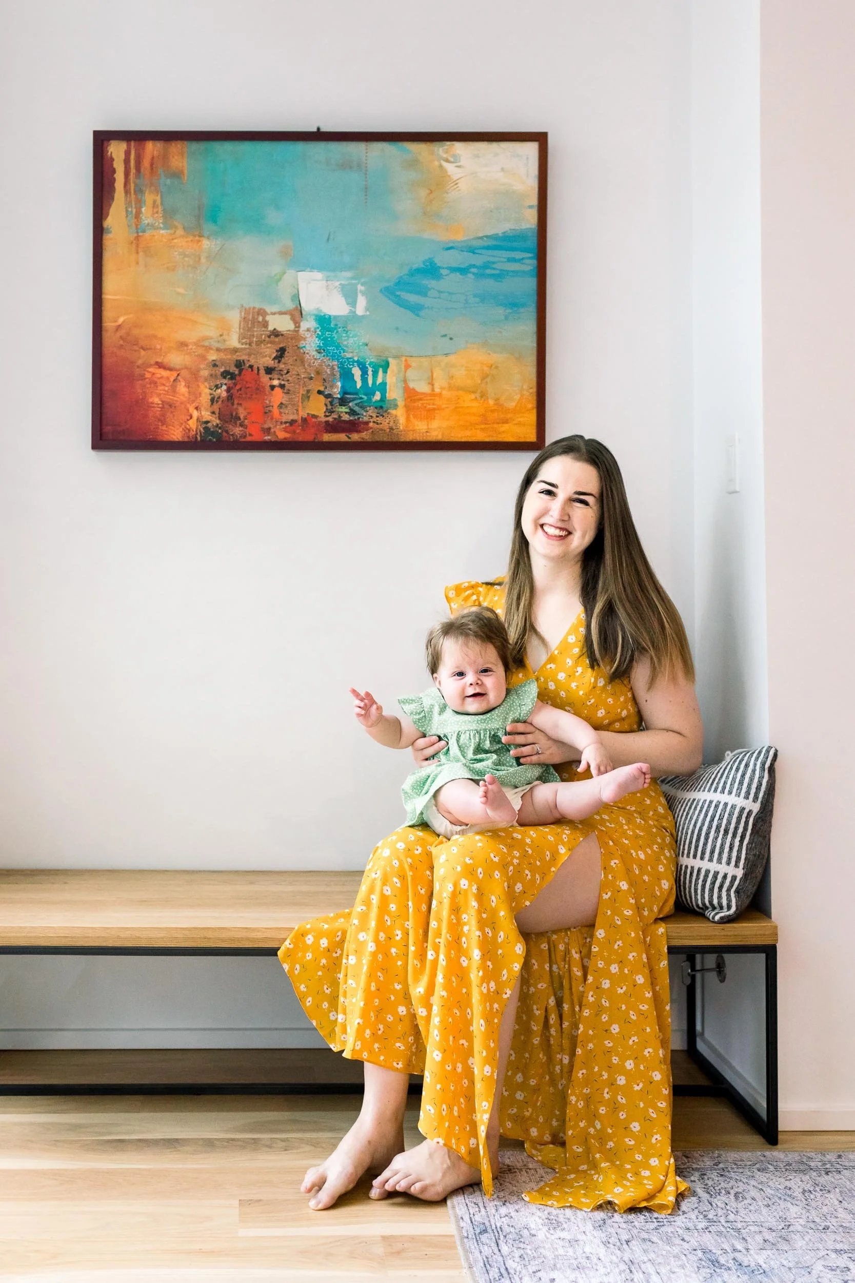 Mother holding baby girl in lap by Caty Lamadrid Lifestyle Photography