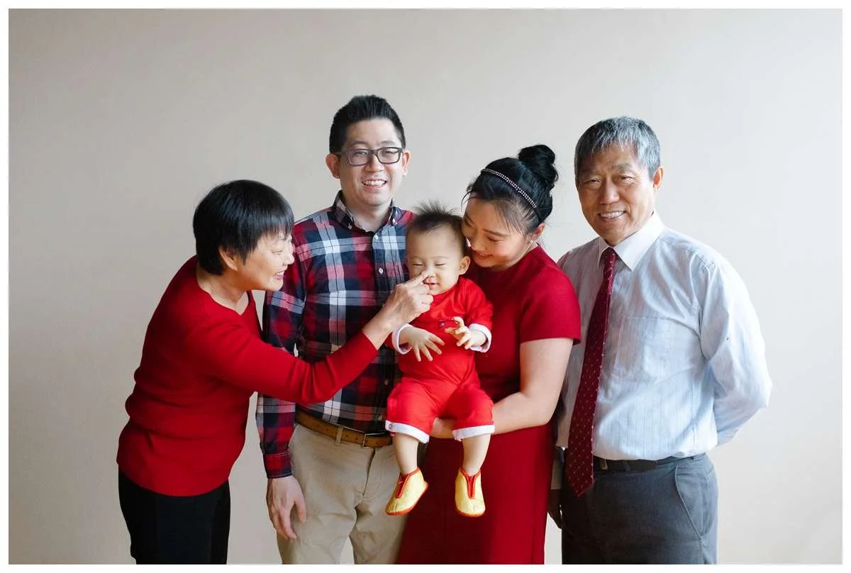 Portrait of parents and grandparents holding a baby boy by Chicago Photographer 