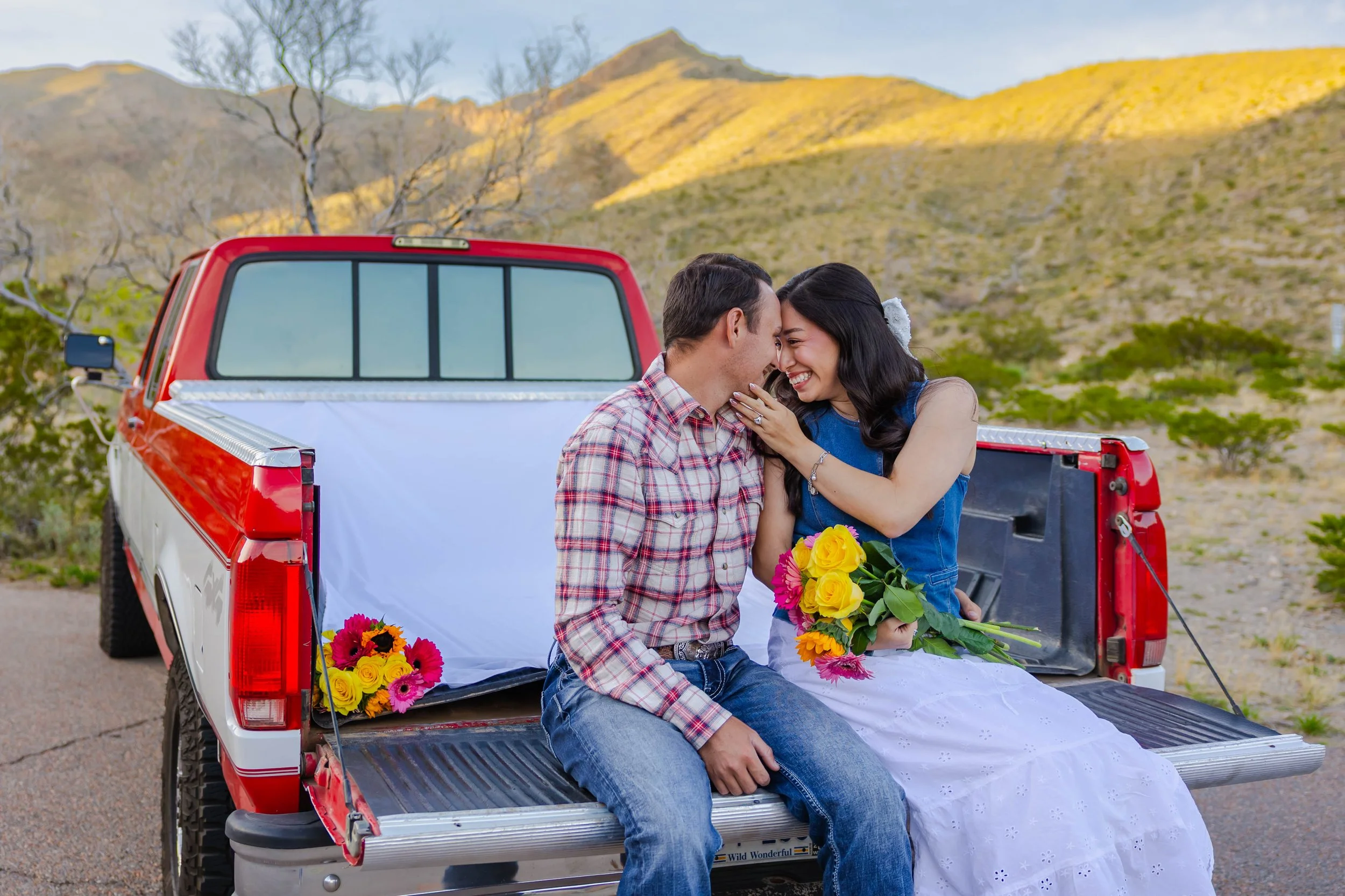 Engaged couple embracing during sunset at McKelligon Canyon in El Paso, Texas.
