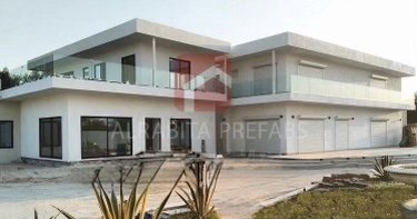 Modern two-story prefabricated house with large windows executed by Alrabita Prefab Co. بيت جاهز دورين بتصميم مودرن وشبابيك كبيرة تم تنفيذه من قبل مصنع الرابطة للبيوت الجاهزة