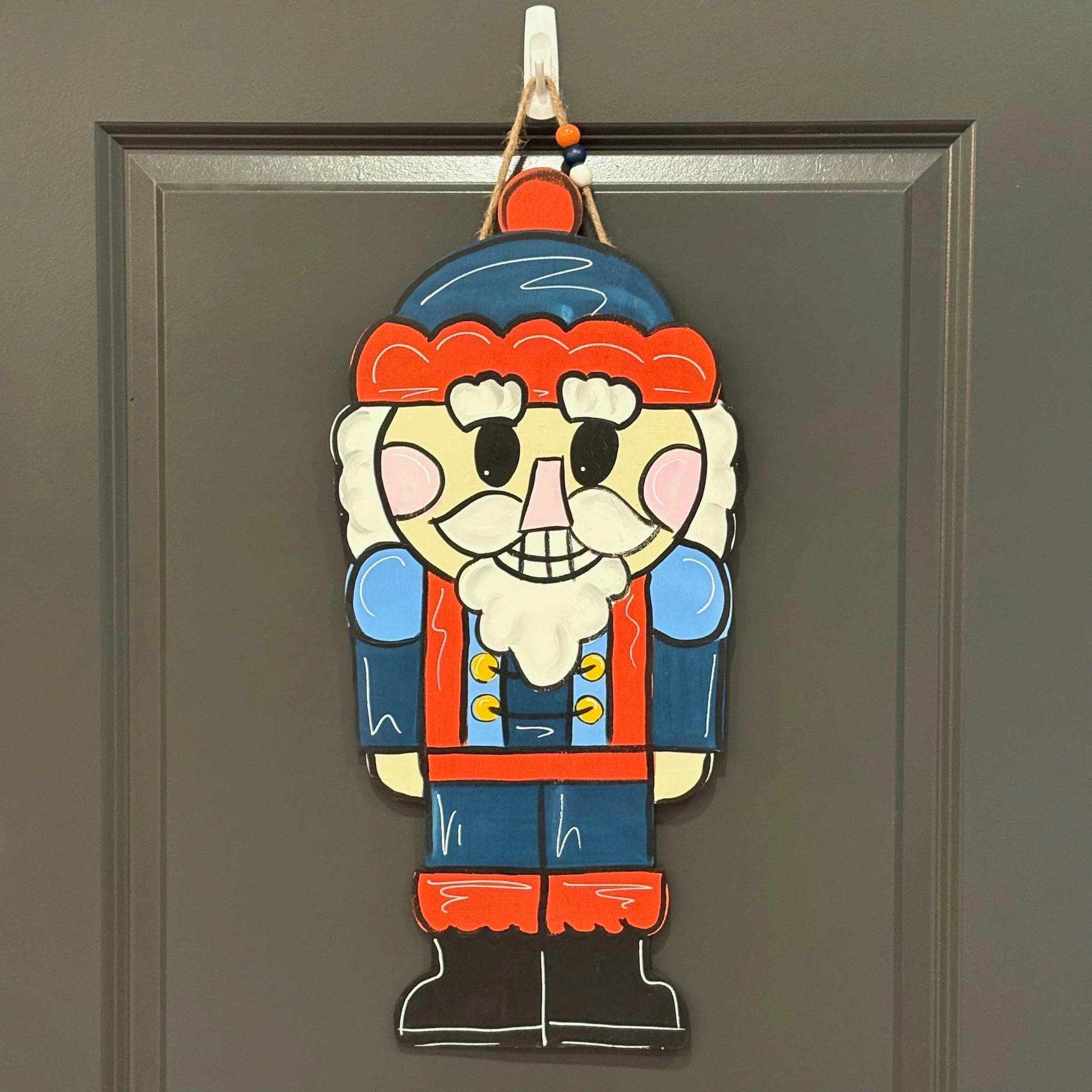 Orange & Blue Nutcracker Door Hanger