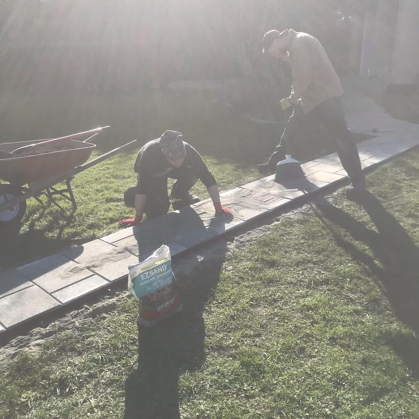 Building a stone paver walkway with some friends #diy #paversidewalk #landscape #walkways #springisintheair #outside