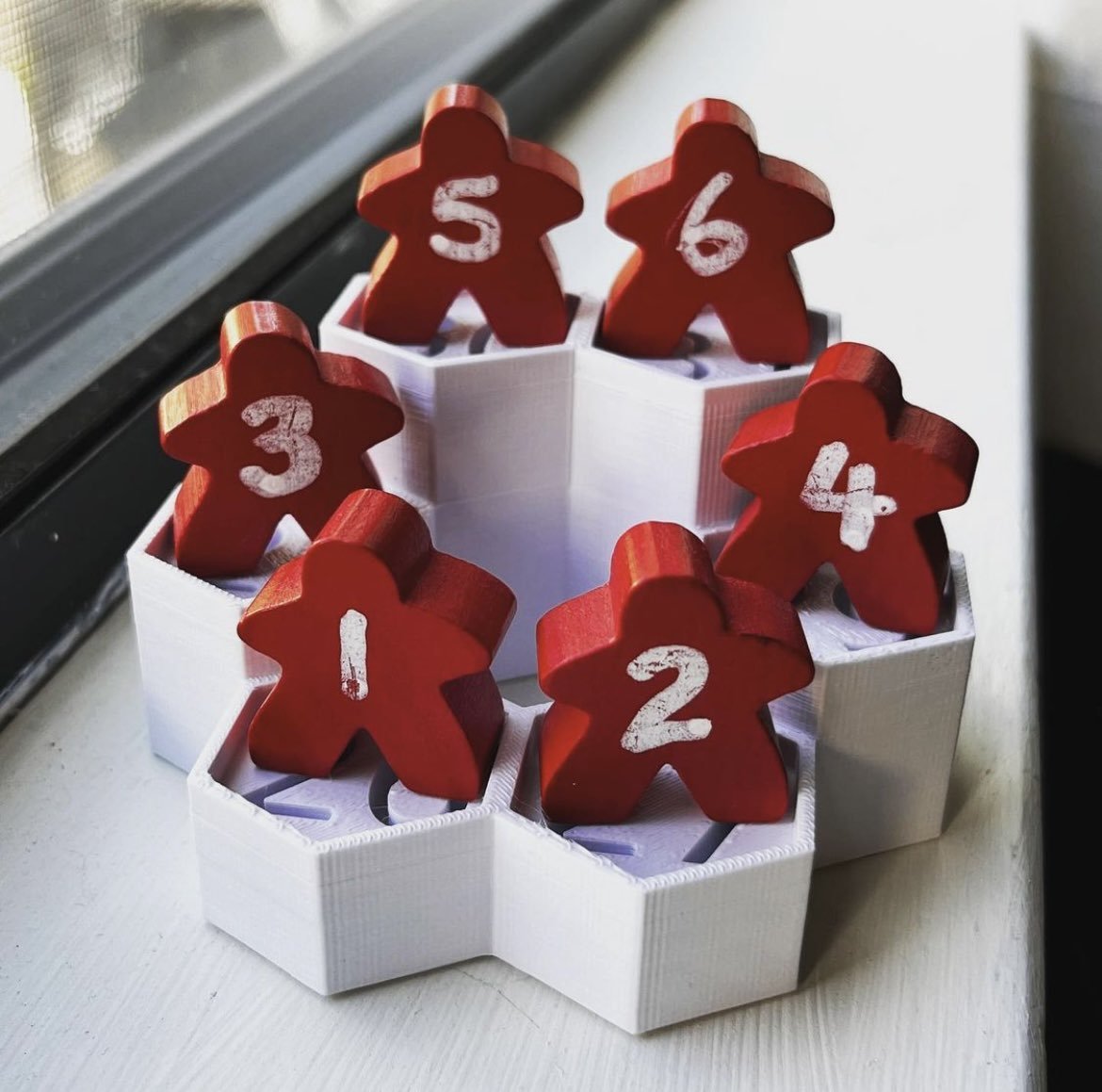 Meeples on top of a display