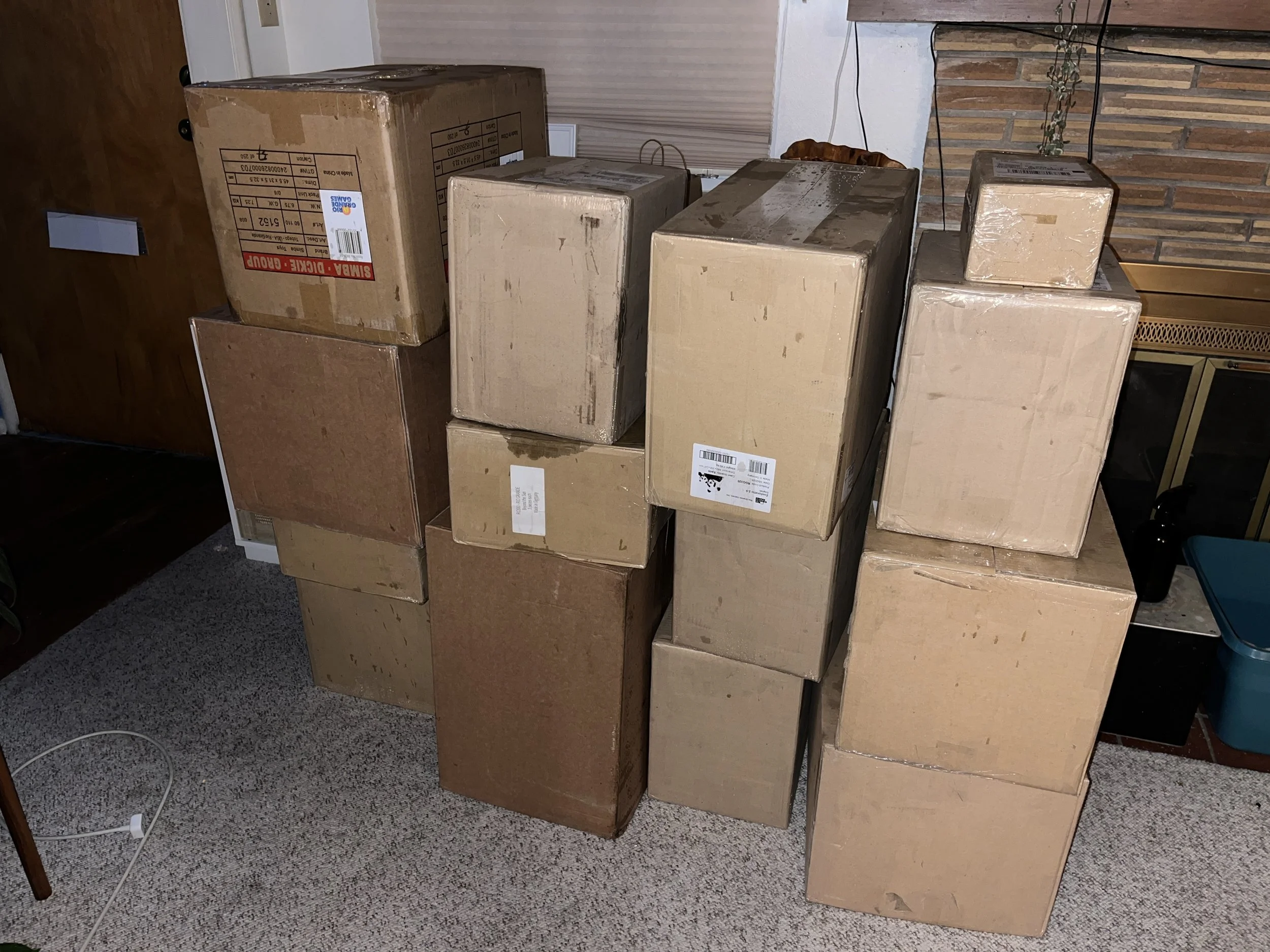 14 boxes with rain marks on a carpet in a living room