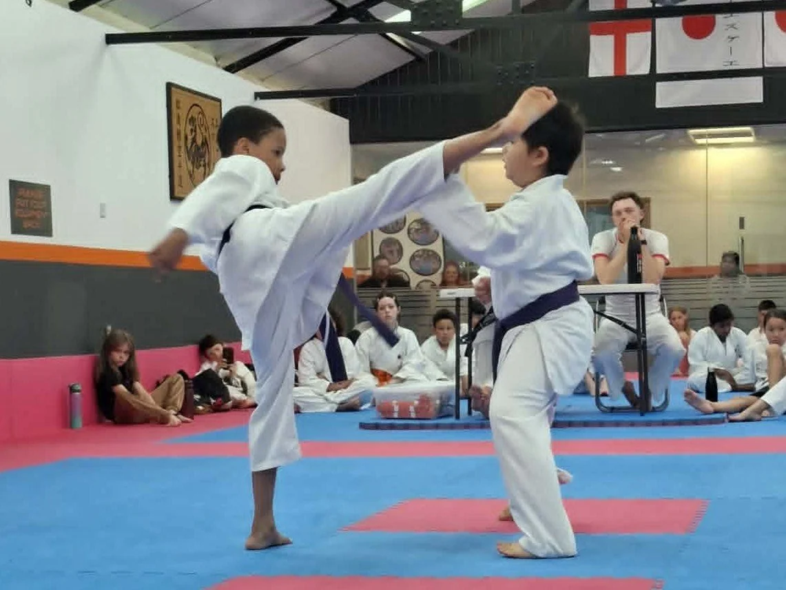 Denzel kicks Oliver.jpg