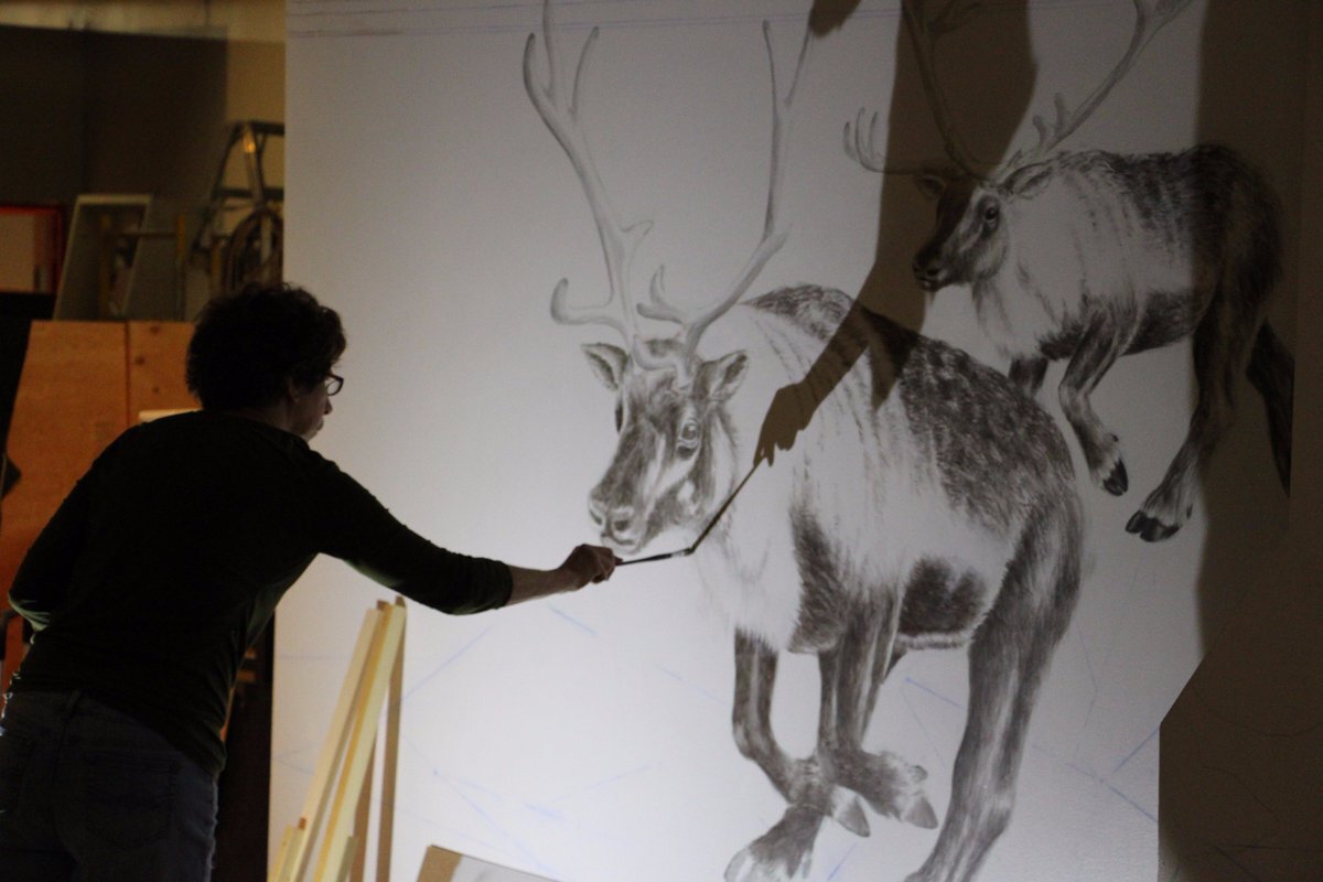 Painting caribou for mural