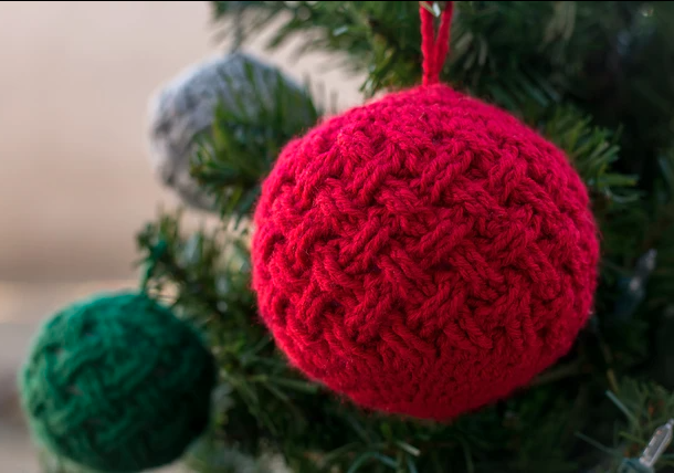crochet basketweave globe ornaments hanging on a tree