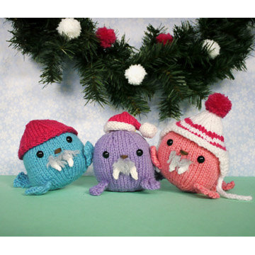 blue, purple, and peach small knit walrus ornaments with winter hats