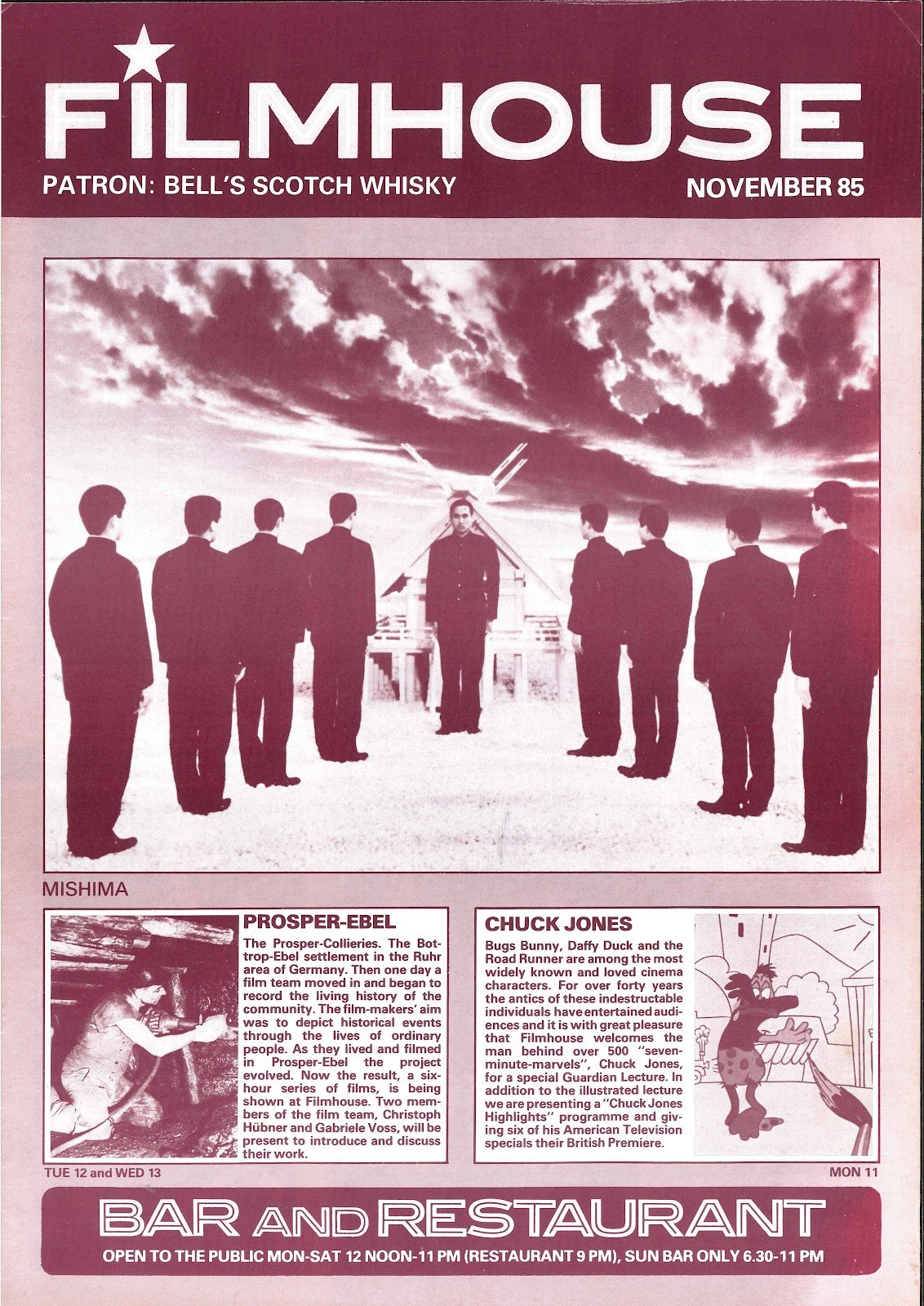 November 1985 issue of Filmhouse magazine featuring a black-and-white image of a man in a military uniform standing in front of a windmill with a group of eight young men in suits facing him, under a sky with dramatic clouds.