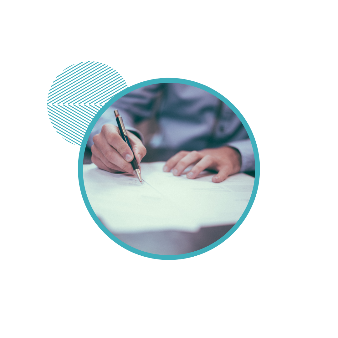 Person in formal attire writing on documents with a pen on a table, surrounded by a circular blue design element.