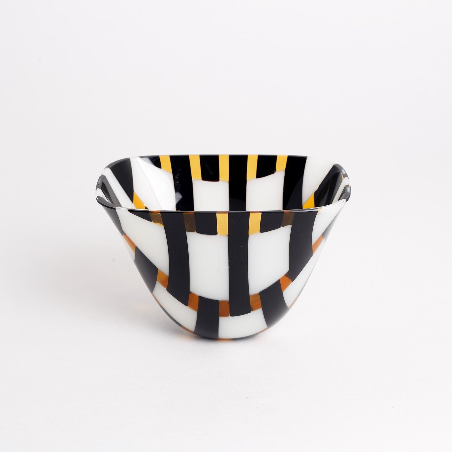 Combining weaving techniques and aesthetics with glass James Lavoie stunning one-of-a-kind pieces that add a touch of whimsy and class to every home arrangement. His Dropout Vessels are a perfect gift for those who love to host.

James is best known 