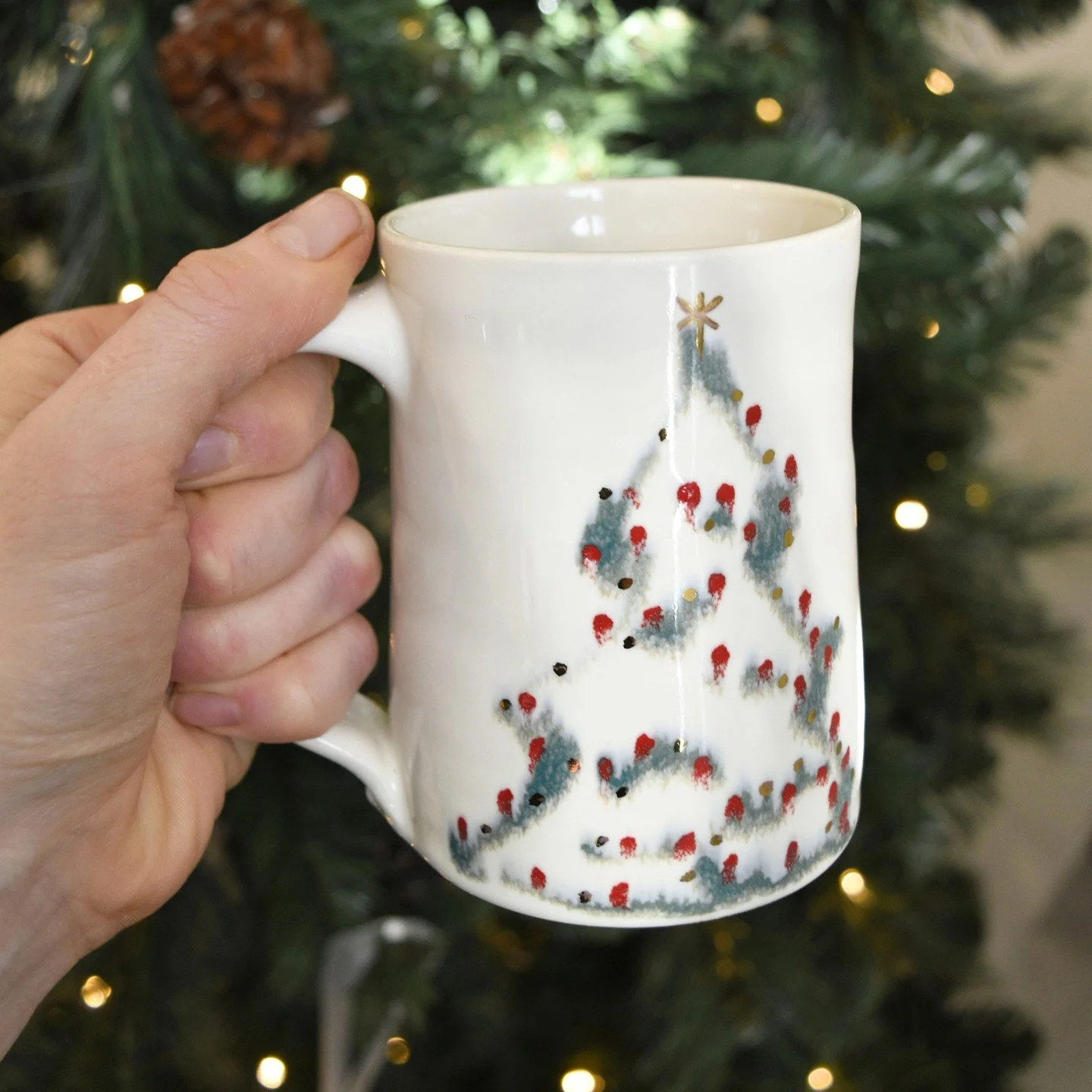 Sip your coffee from a handcrafted mug adorned with a Christmas tree while enjoying the glow of your own. Calgary shoppers, Barb Howe&rsquo;s Christmas Tree mugs have arrived at our Calgary Gallery + Shop.

Image: Christmas Tree mug (large), Barb How