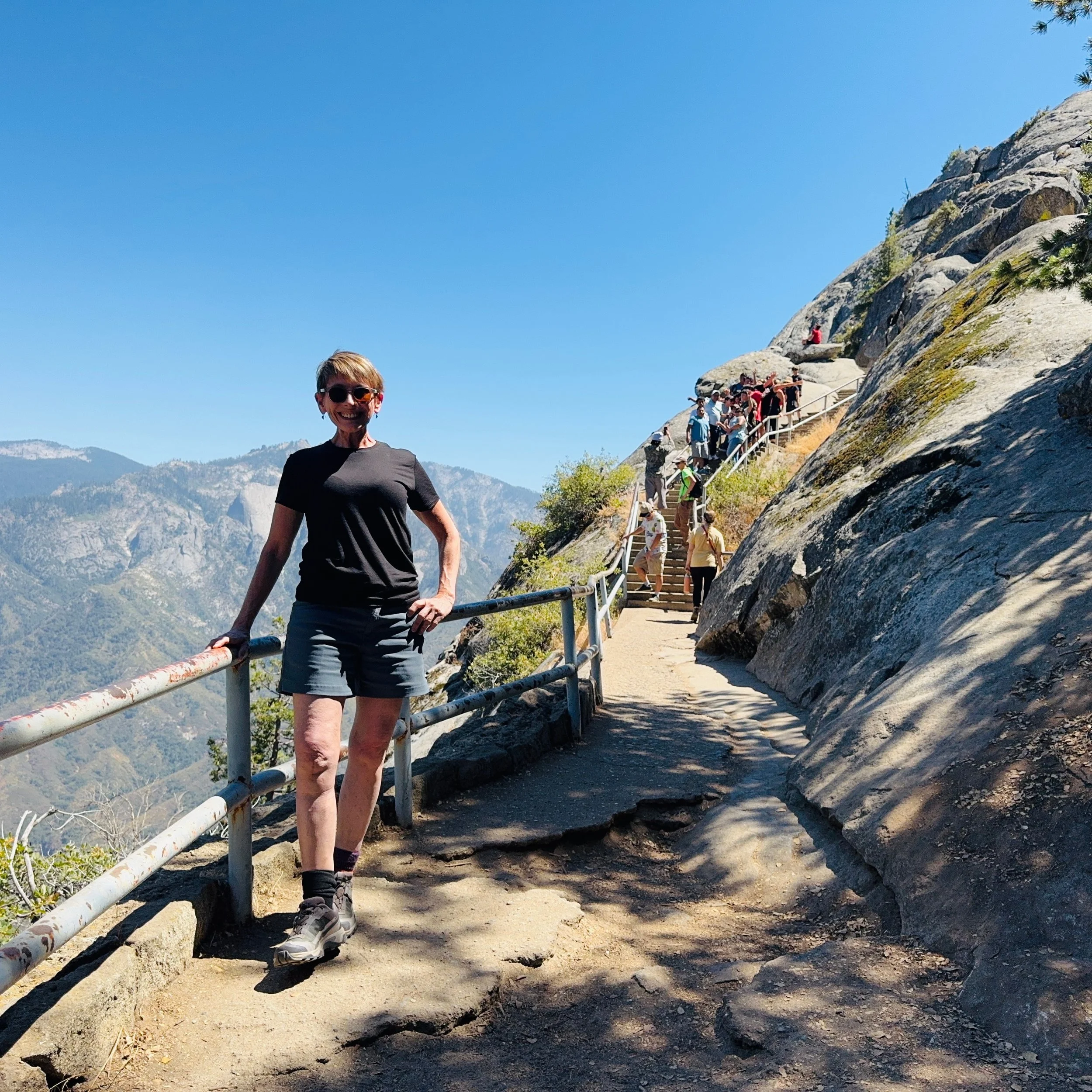 Climbing up the exposed face of Moro Rock with steep drop offs on each side and the Great Western Divide reaching out into the horizon beyond and reaching the peak of the granite dome, my heart fluttered with excitement and joy, having overcome my fe