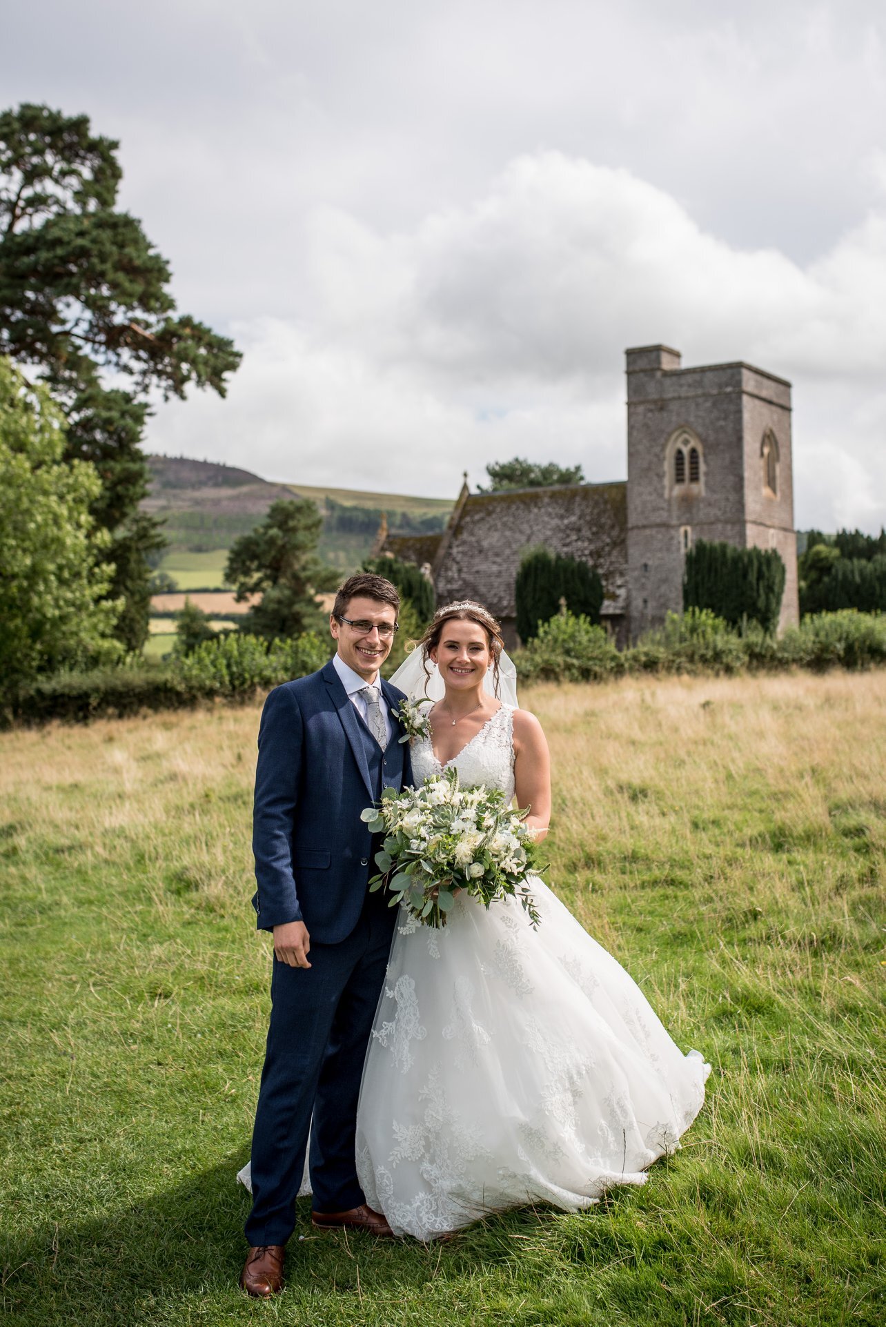 Couple happy in front of Llangasty Church.jpg