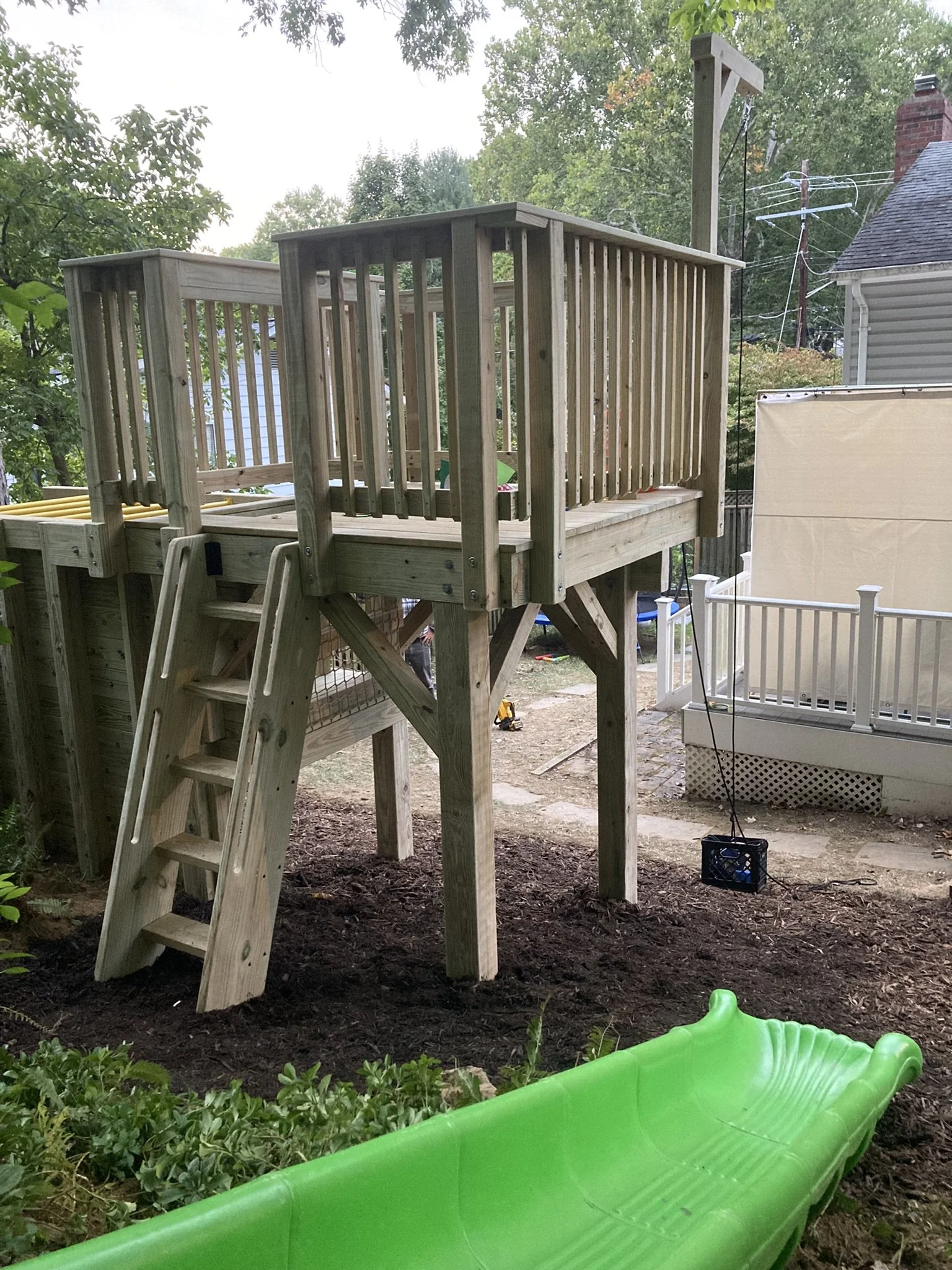 Play structure with a ships ladder.