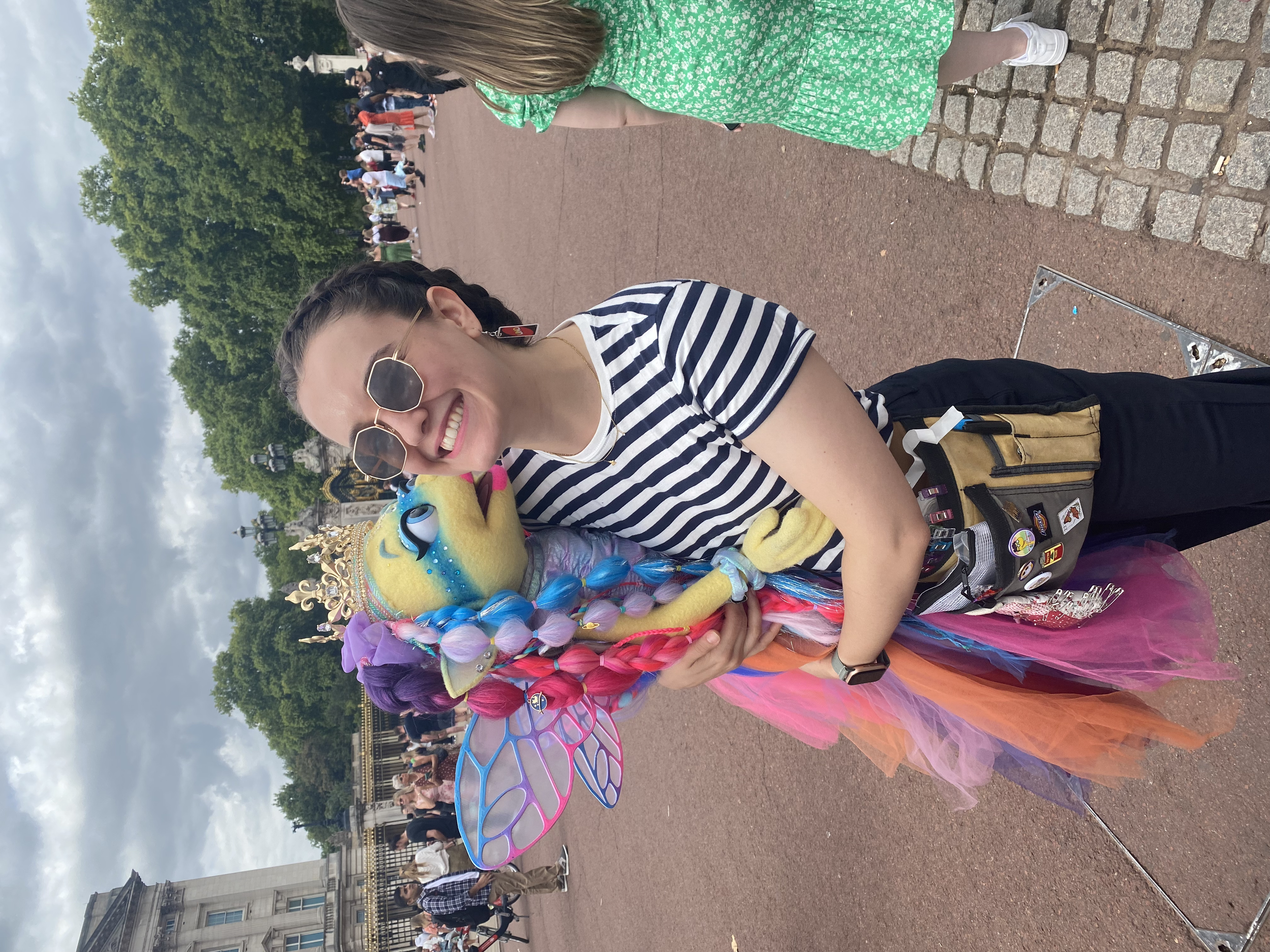 Rose wrangling Coldplay's Angel Moon puppet at Buckingham Palace