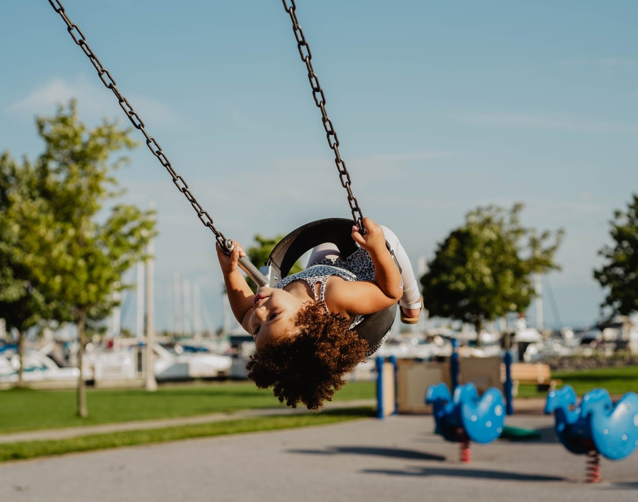 child swinging on a swing