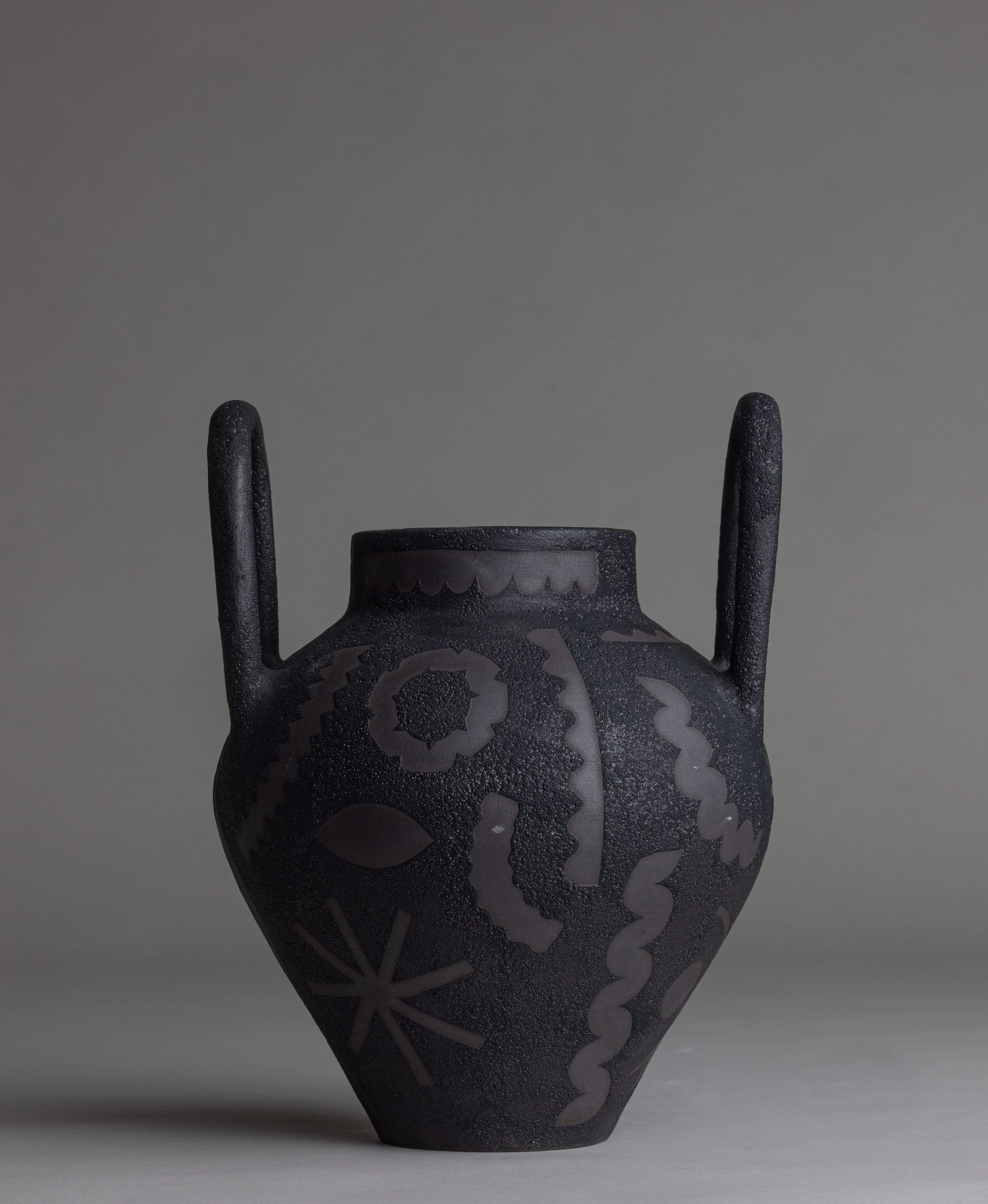 25. 
 large black picto vase  
$ 