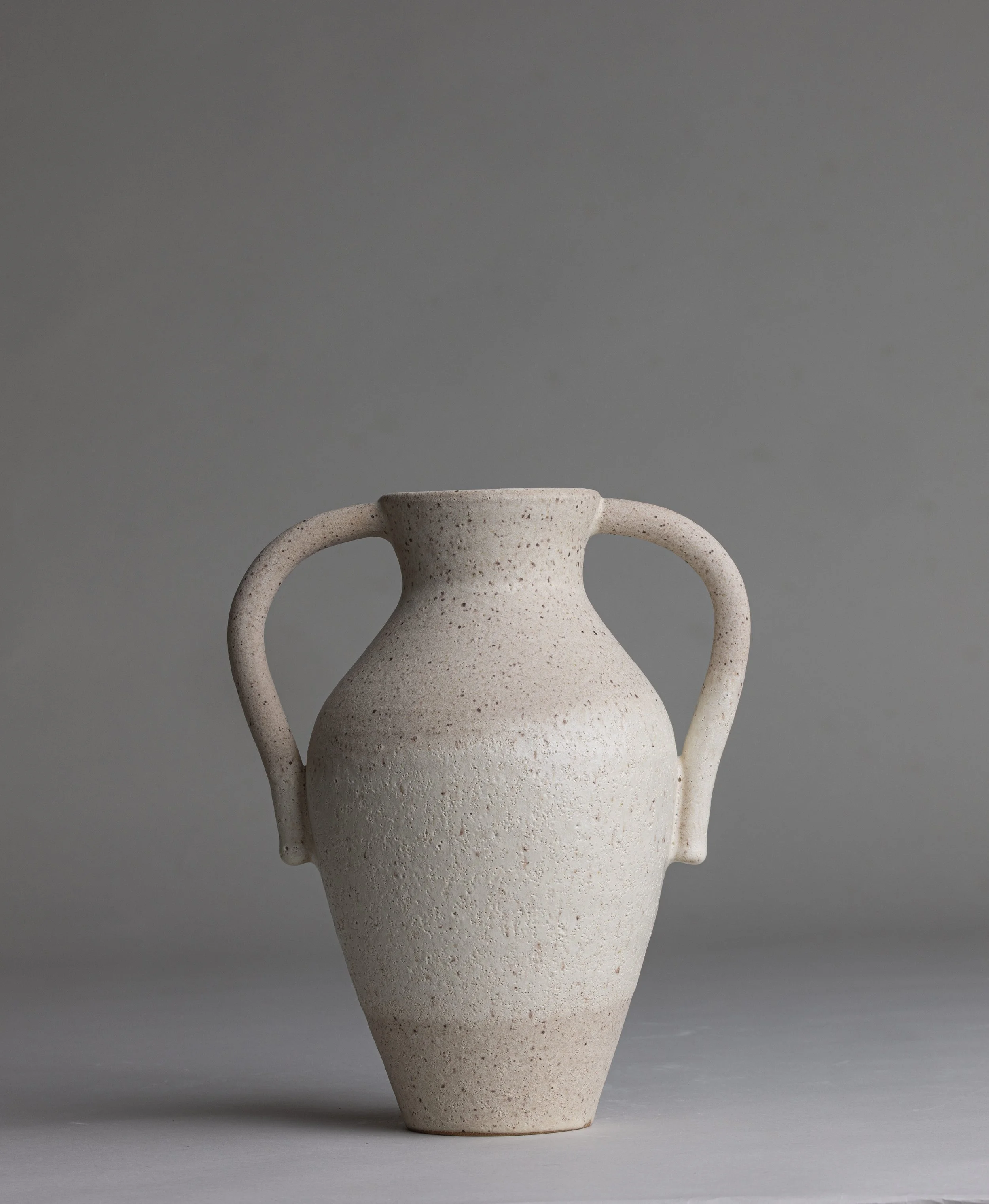 12. 
 medium curvey handle vase  
$ 