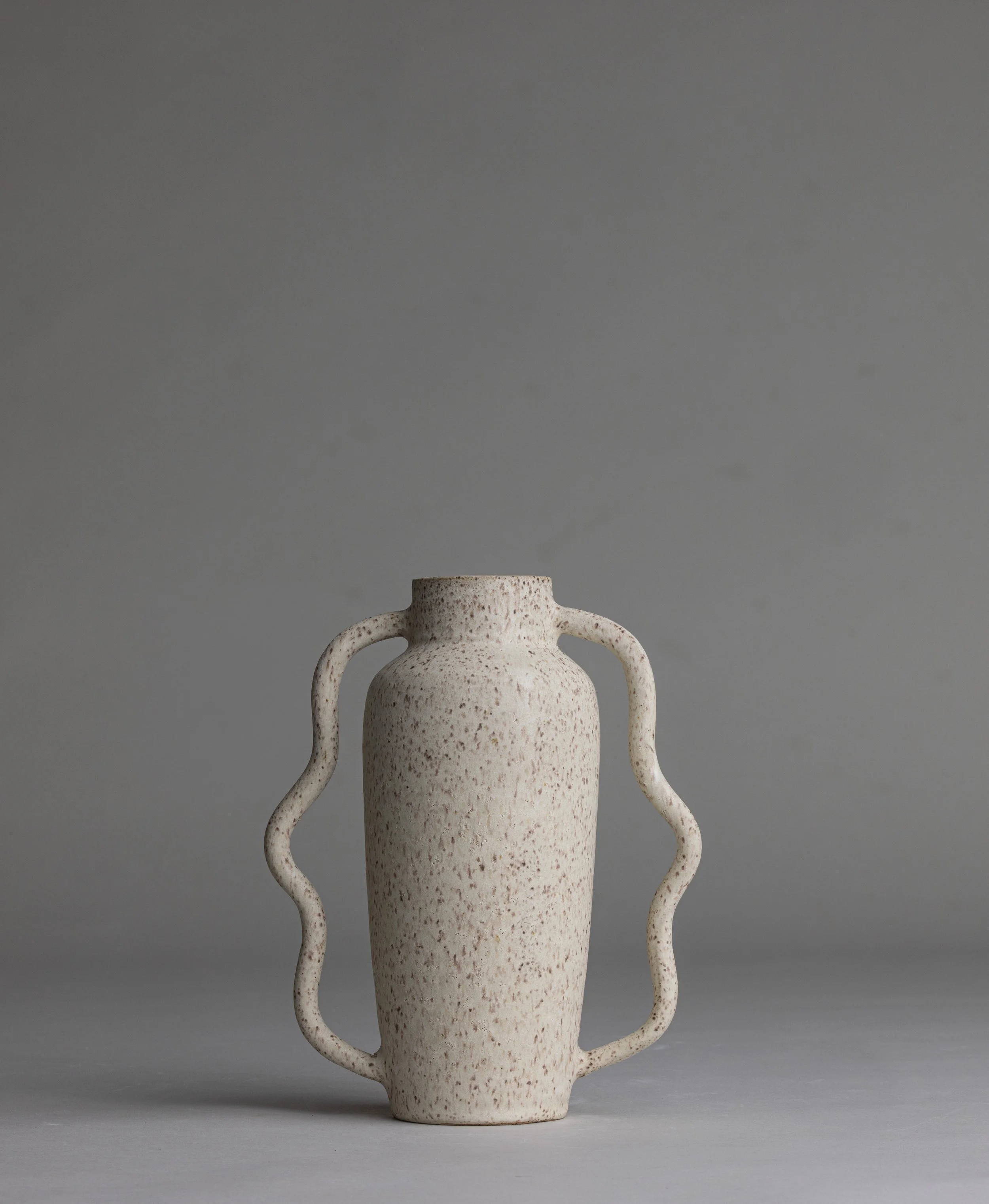 06. 
 small wavy handle vase  
$40 