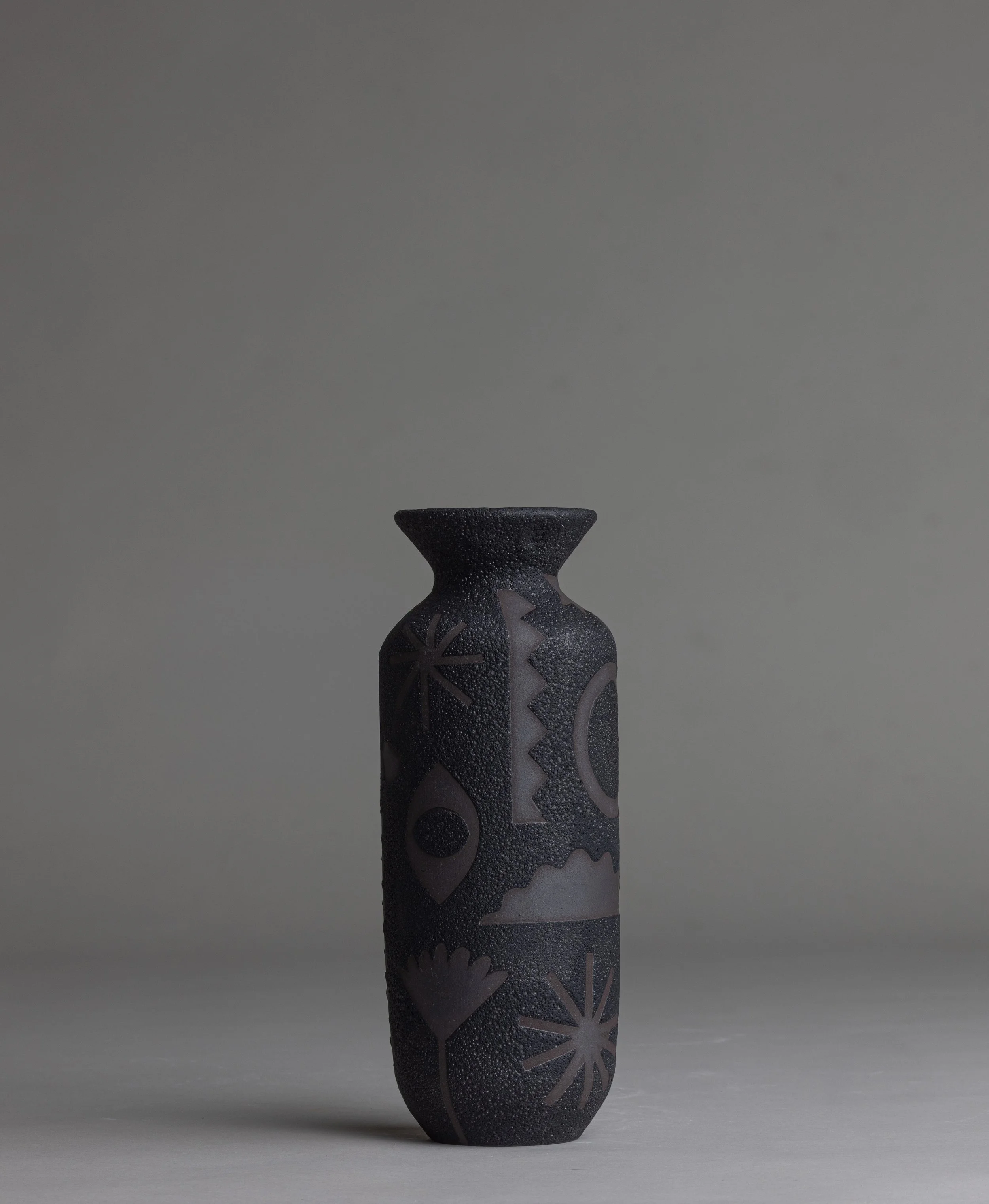 24. 
 small black picto vase  
$ 