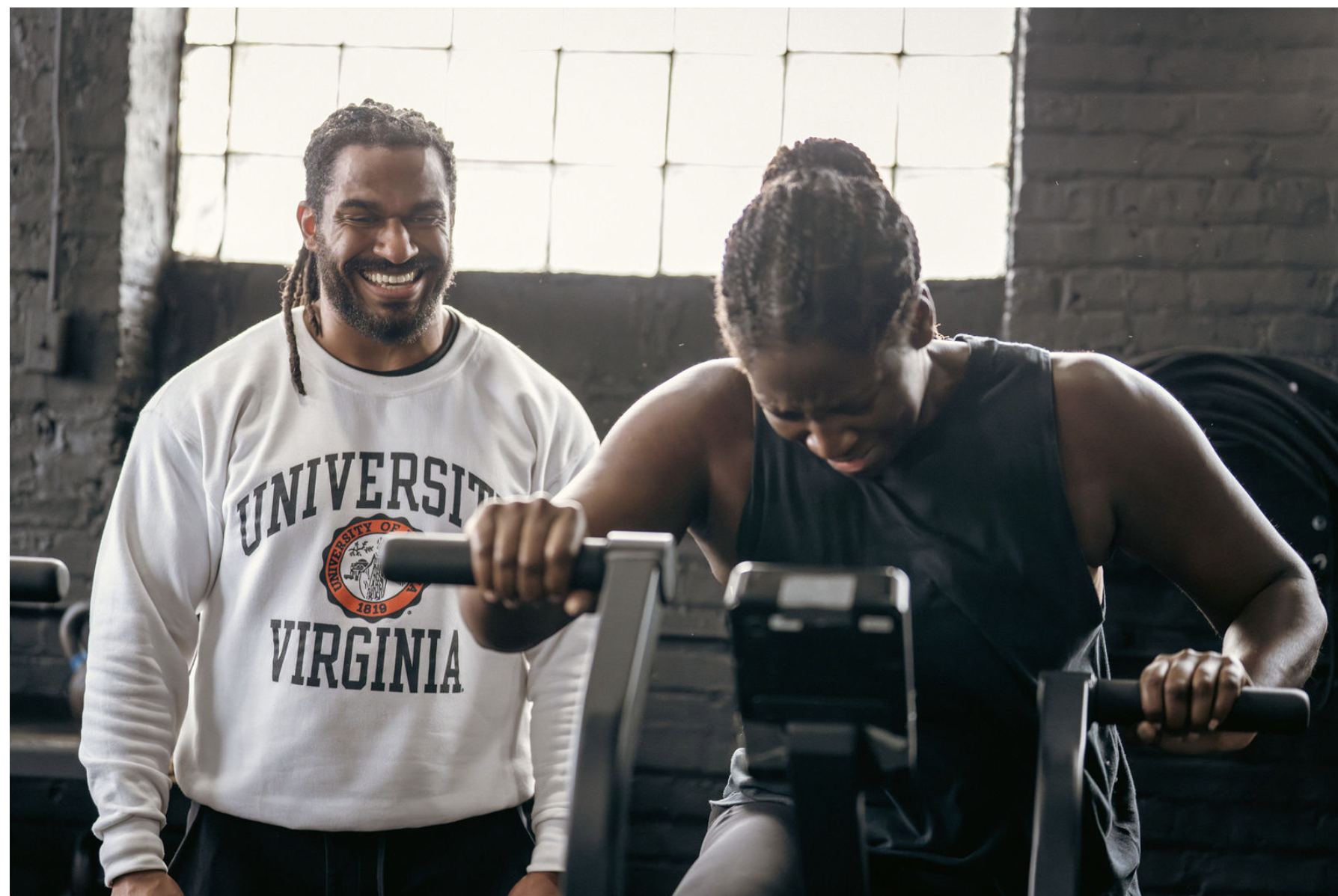 Members of The Garage Chicago celebrating a workout together after a strength training session in Chicago.