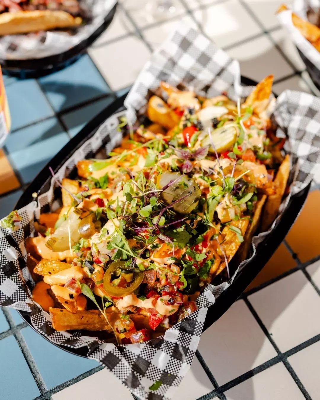 LOADED LATIN CHIPS 🍟🍟 With vice sauce, bell pepper sauce, pickles, jalepenos &amp; biquinos. Get your fingers dirty and dig in.