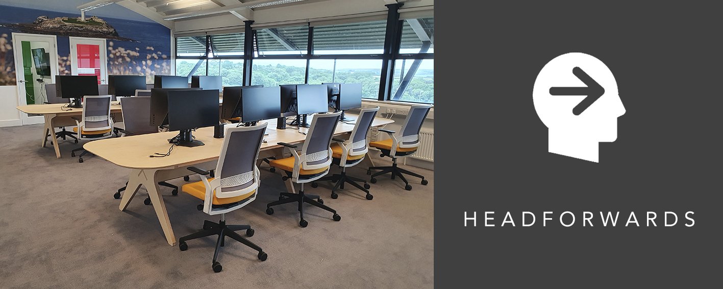 office space with opendesk collaboration table with monitors and surrounded by office chairs with headforwards logo.jpg
