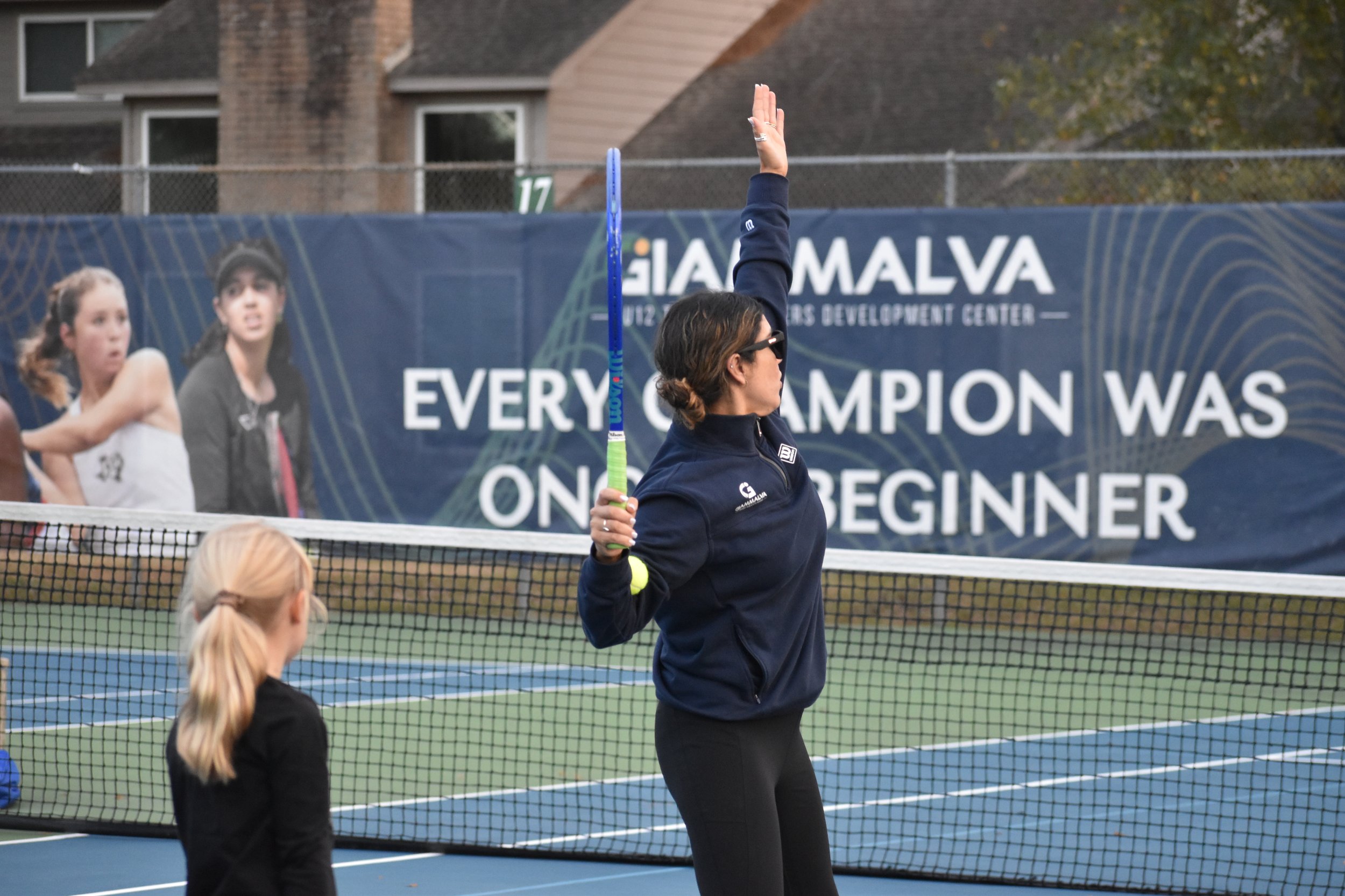 Helga Pinones-Haltenhoff coaching in the Under 12 program at Giammalva Racquet Club