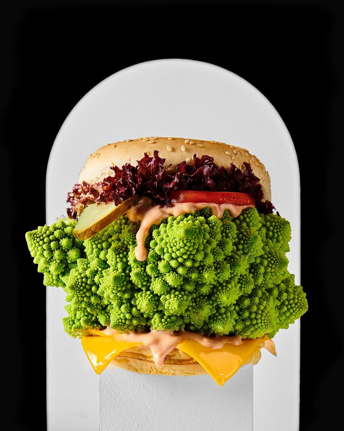 VEGGIE BURGER. Creating surreal Veggie Burgers by swapping out the meat patties for a huge raw piece of veg. The Romanesco cauliflower provides a strong colour, fantastic textures and an alien-like / landscape effect.
&gt; lauriking.com/projects/vegg