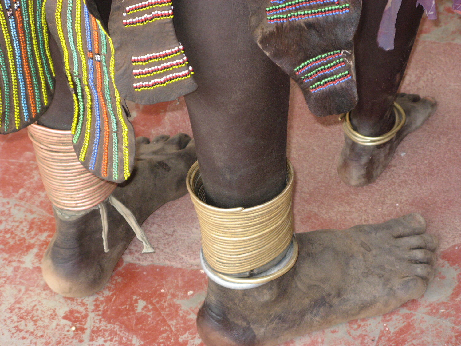 Toposa anklets fashioned from bullet casings.jpeg