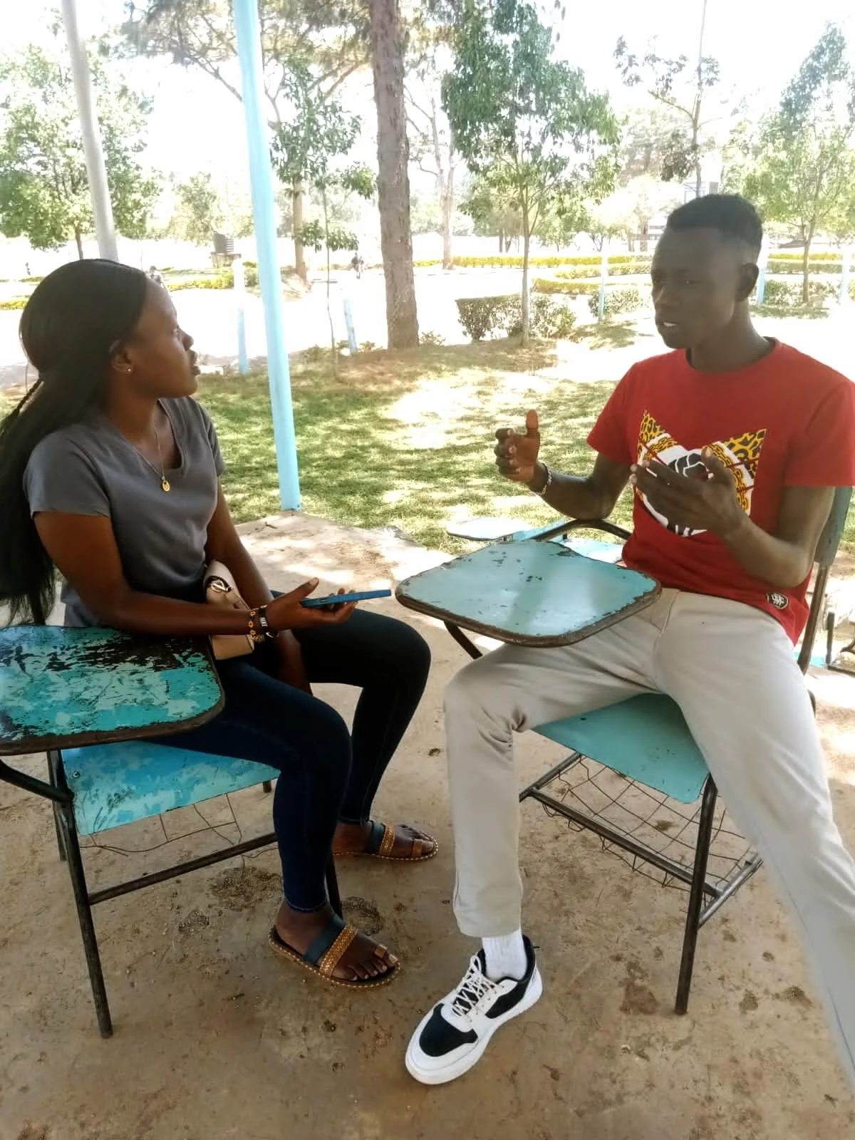 Esther tutors younger student in her program.jpg