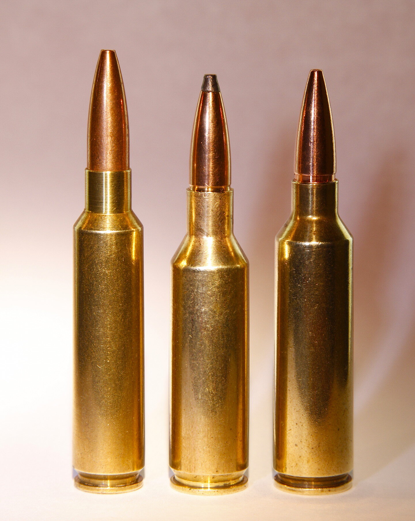 Left to right are three of our best short-action 7mms: 284 Win., 7mm SAUM a...