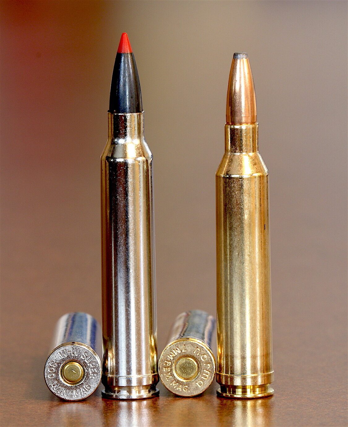Image shows the longer 300 Win Mag cartridge beside the shorter 7mm Rem Mag. 
