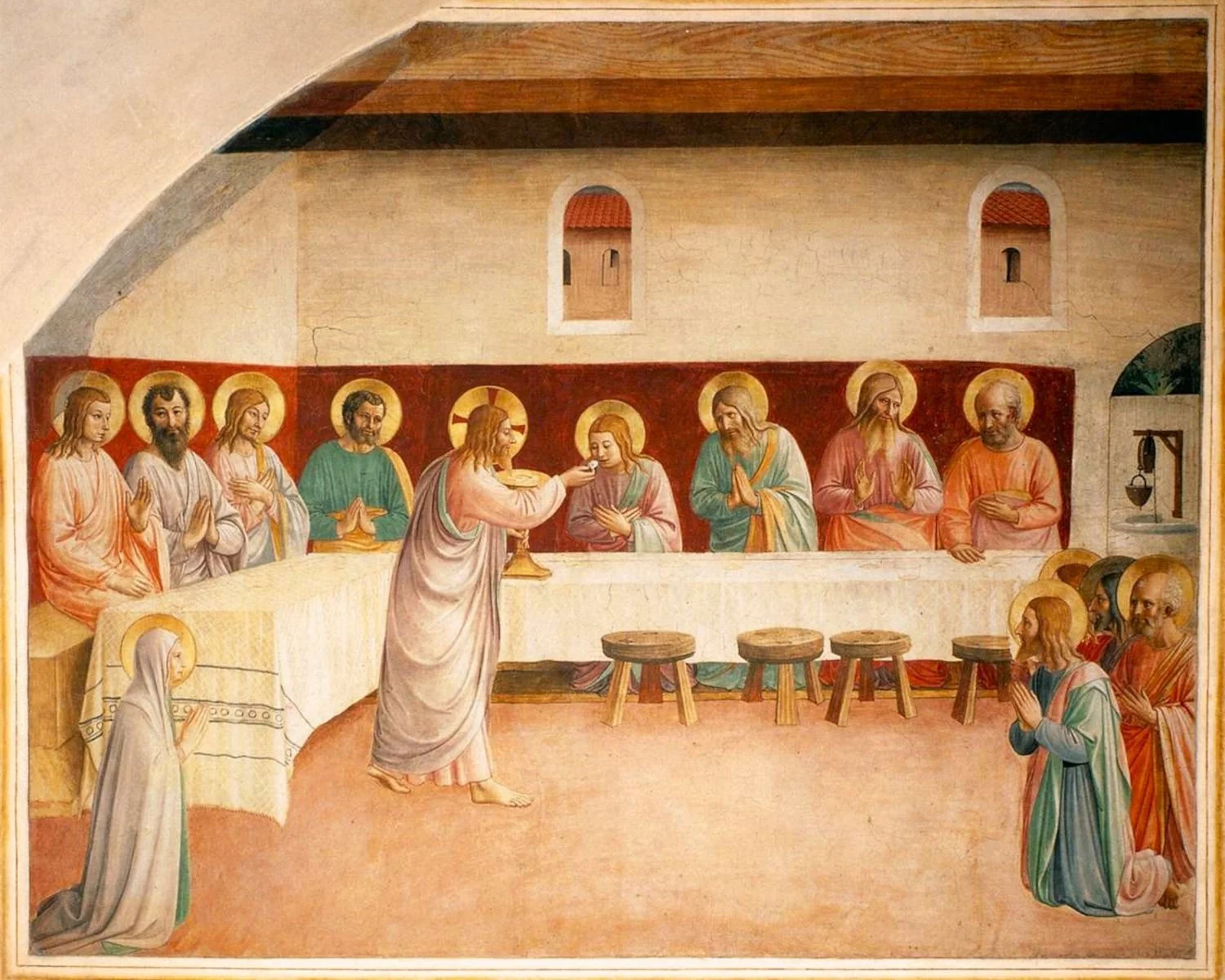 The Institution of the Eucharist by Fra Angelico.  Jesus with the twelve apostles and Mary.  He is giving them Communion.