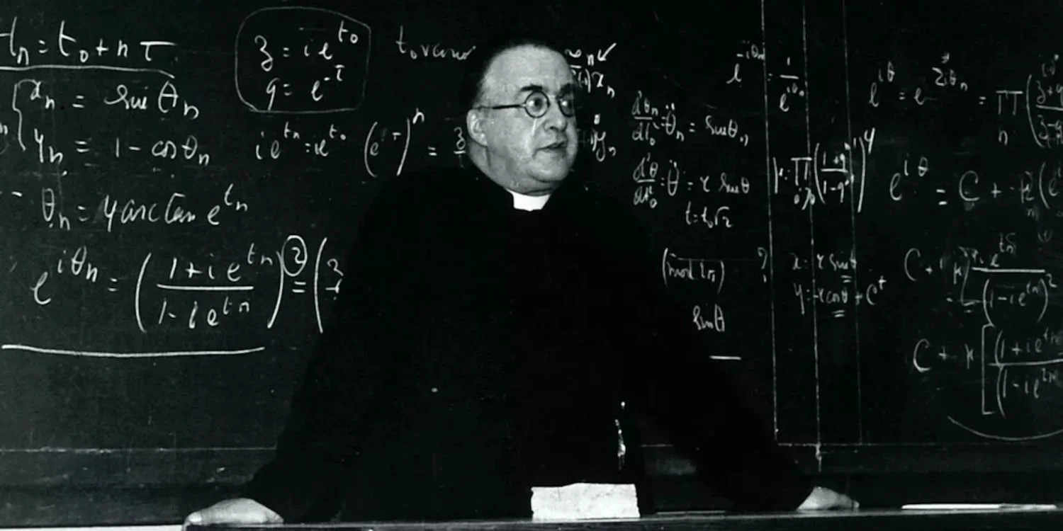 Father Georges Lemaitre in front of a blackboard full of equations.
