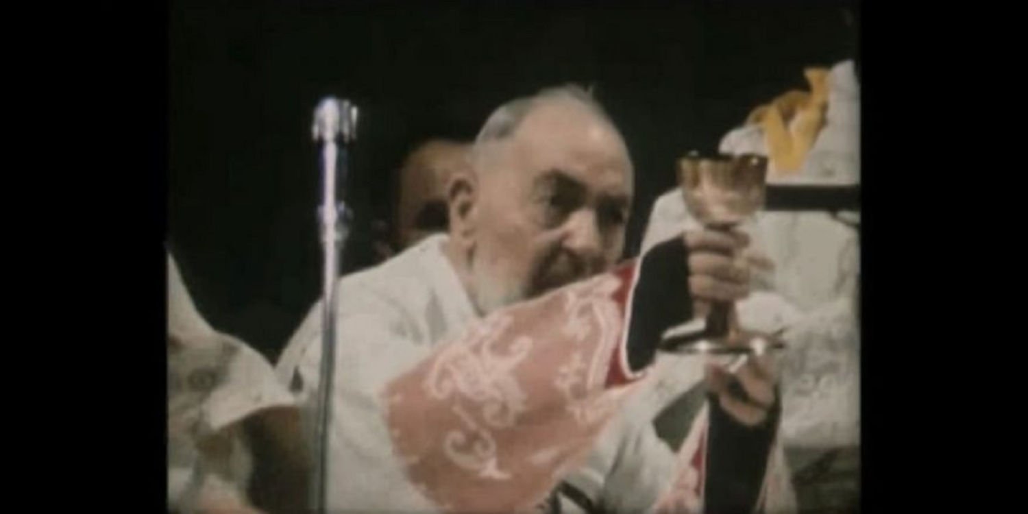 Padre Pio at the elevation of the chalice after having consecrated wine into the Blood of Christ