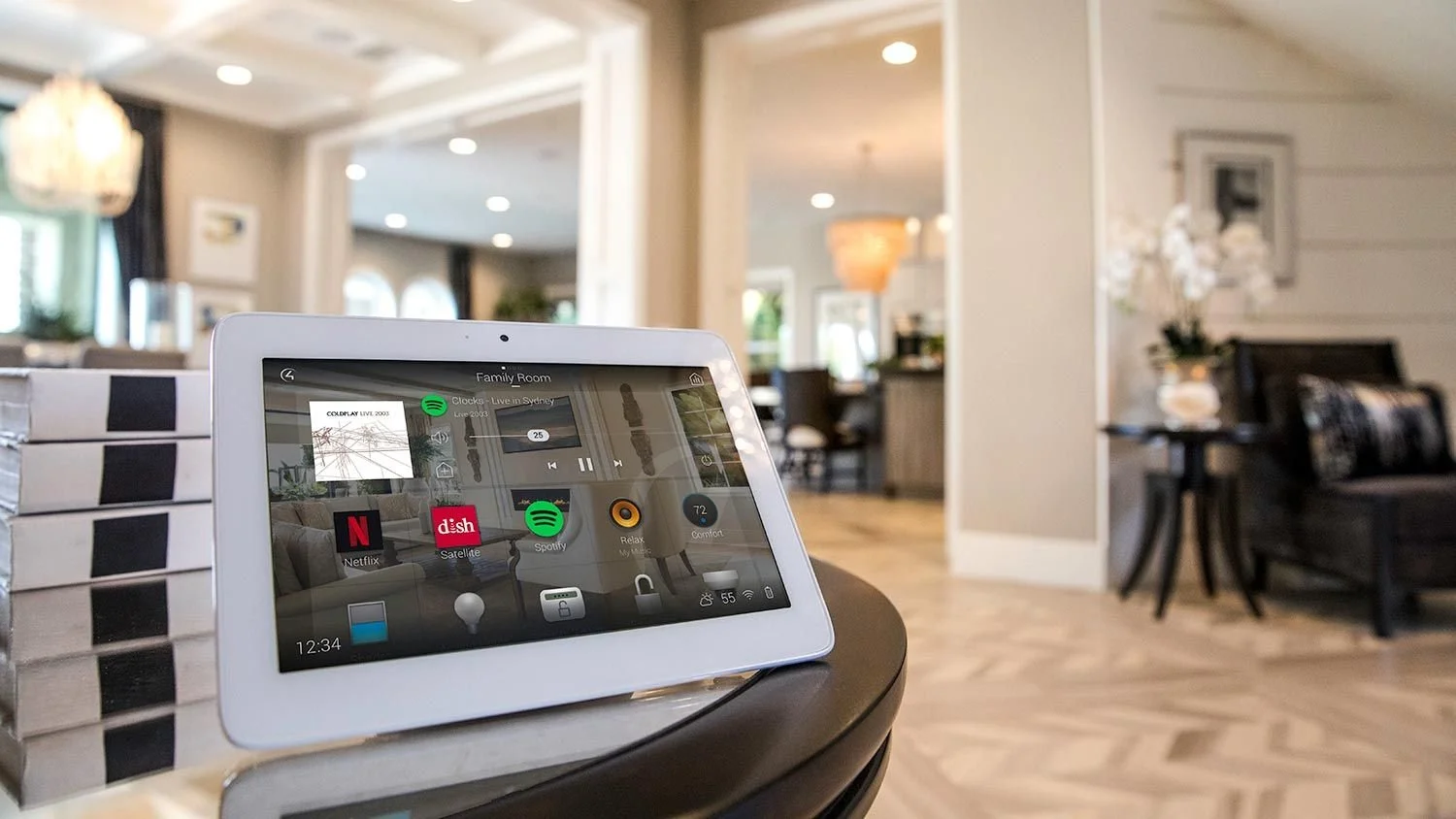 Ipad showing multiple streaming services linked to the smart home system