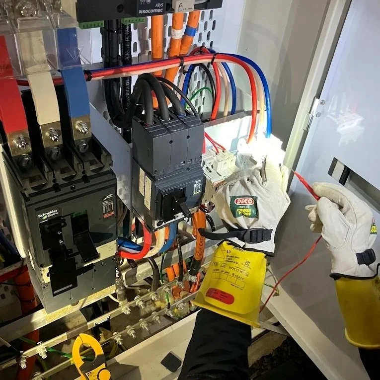 electrician-testing-commercial-switchboard-clamp-meter.jpeg