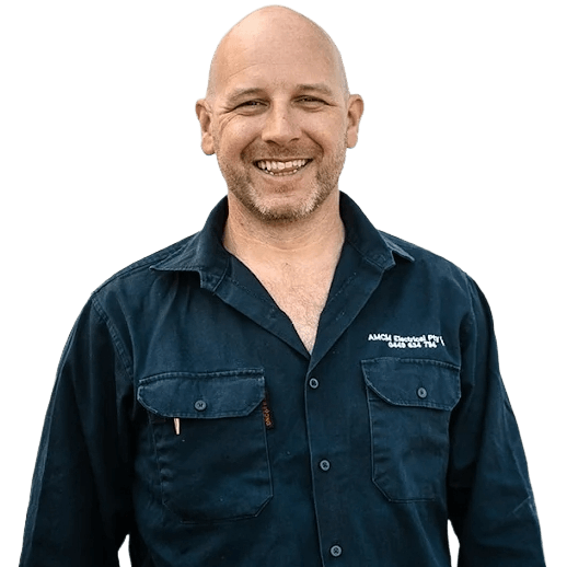 Portrait of Marty Meehan wearing a branded dark blue button-up shirt with chest pockets.