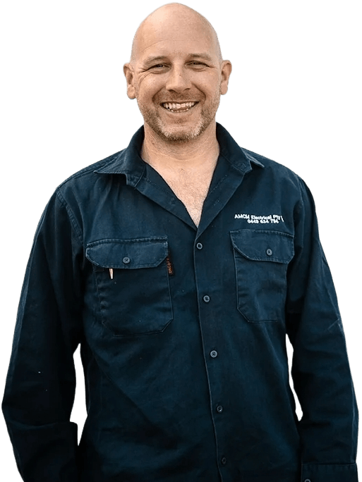 Portrait of Marty Meehan wearing a branded dark blue button-up shirt with chest pockets.