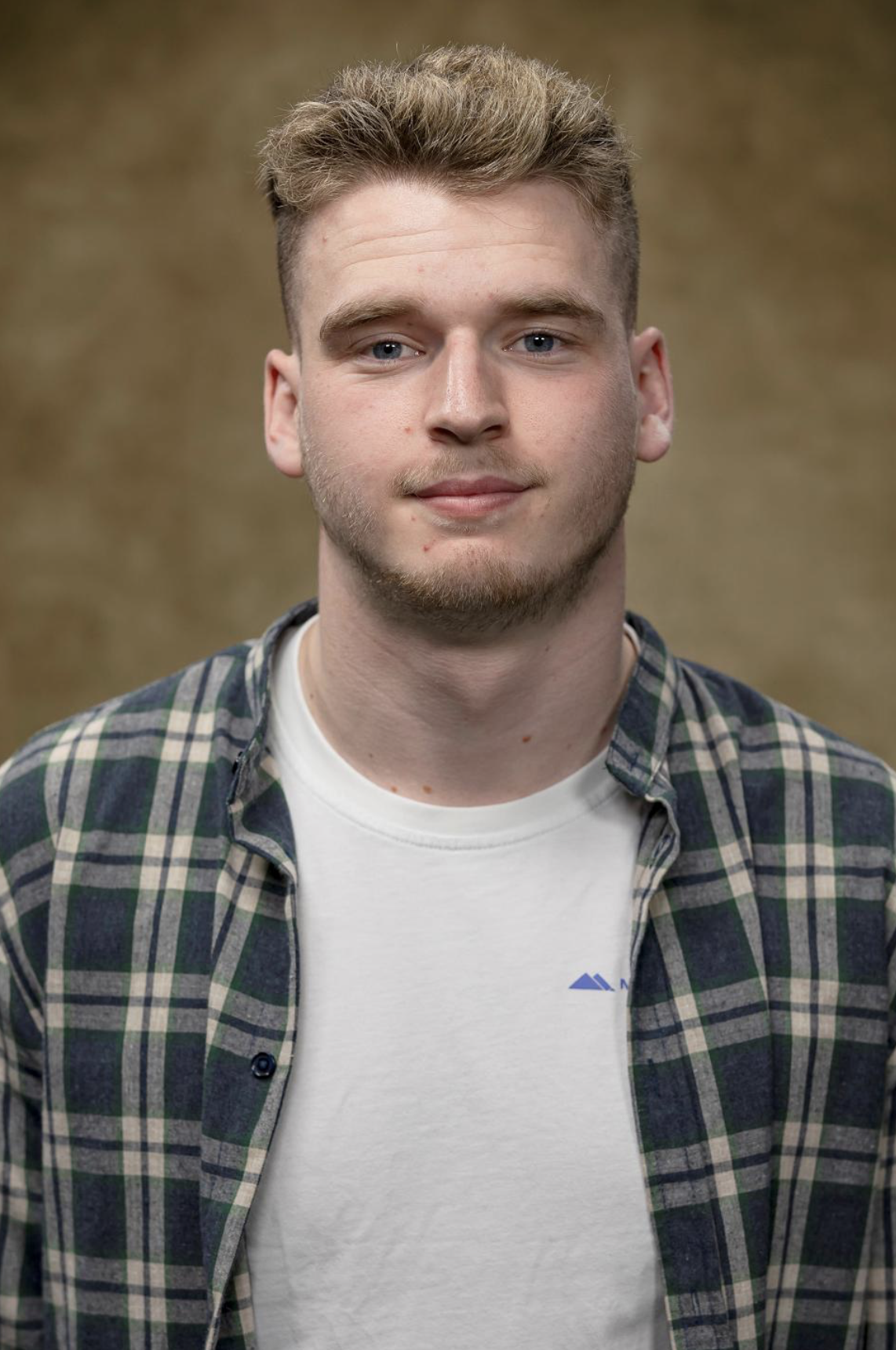 Headshot of actor Daniel Connor Smith. Daniel is a white male between the ages of 17-28. He has thick brown coarse hair