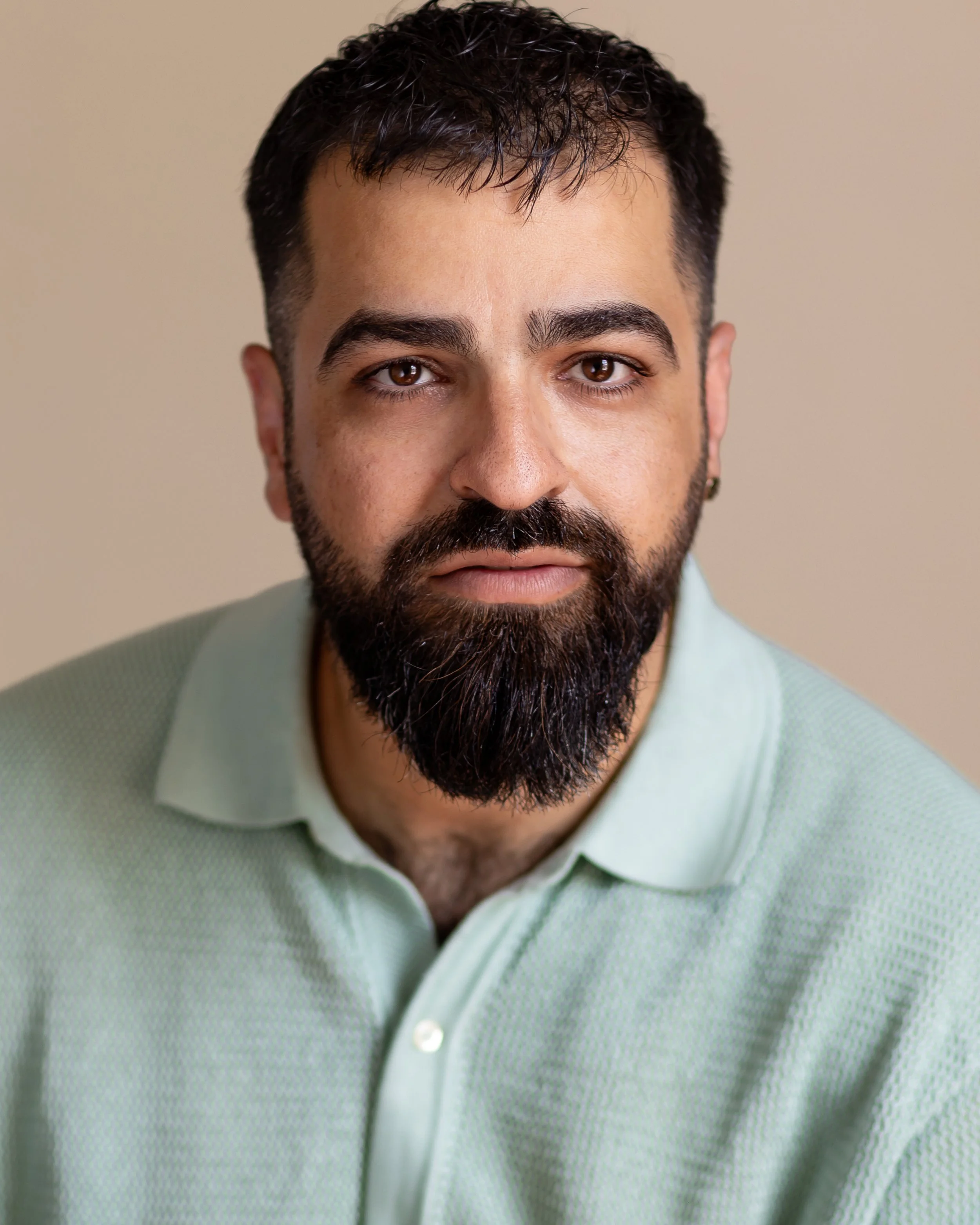 Hamed is white asian (Iranian) male between the ages of 20-30. with black straight hair