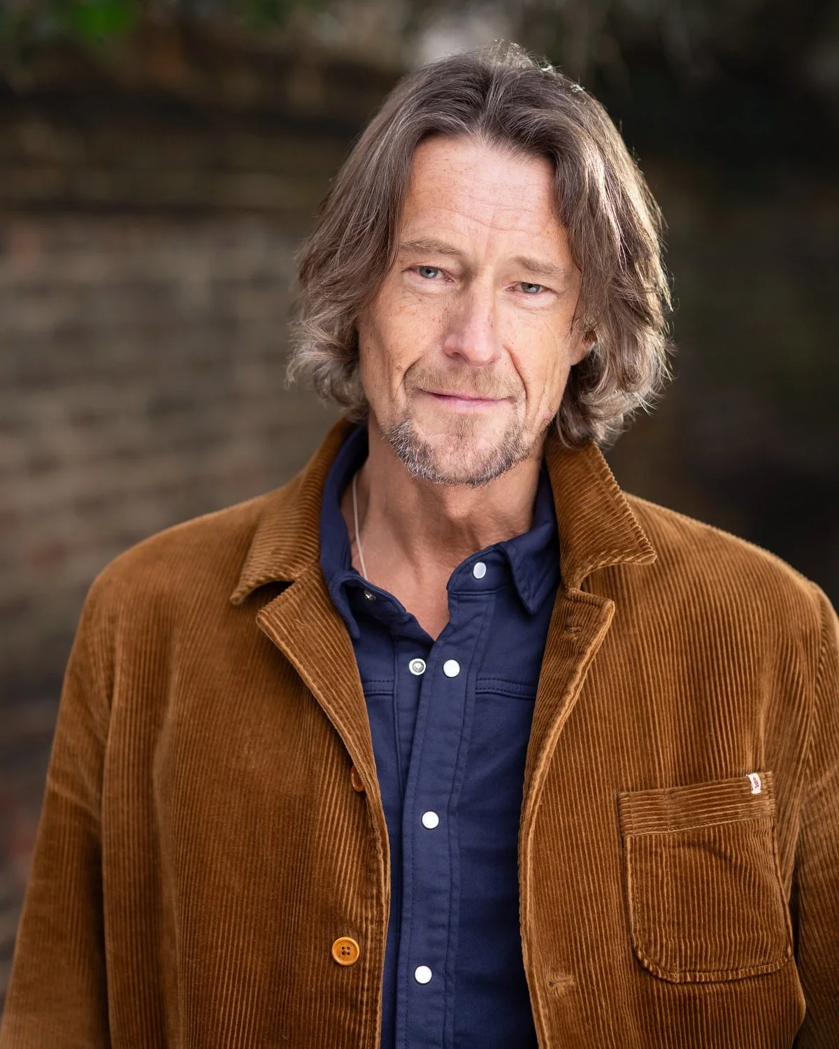 Headshot of actor James Wilde. James is a white male with chin length light brown hair. He is aged between 45-60 and is 6'5 with a slim build.