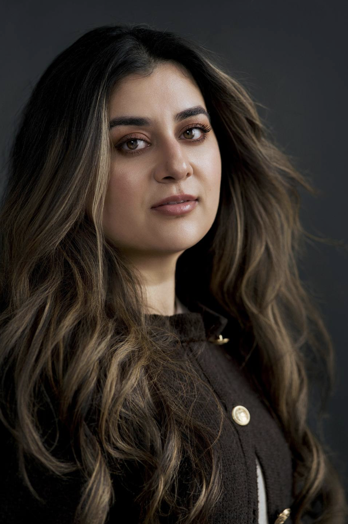 Headshot of actor Sofia Alexandria. Sofia is a Young/Adult female with Parted long, thick, wavy hair, with a widow's peak. She has olive, tan, medium skin. South Asian ethnicity.