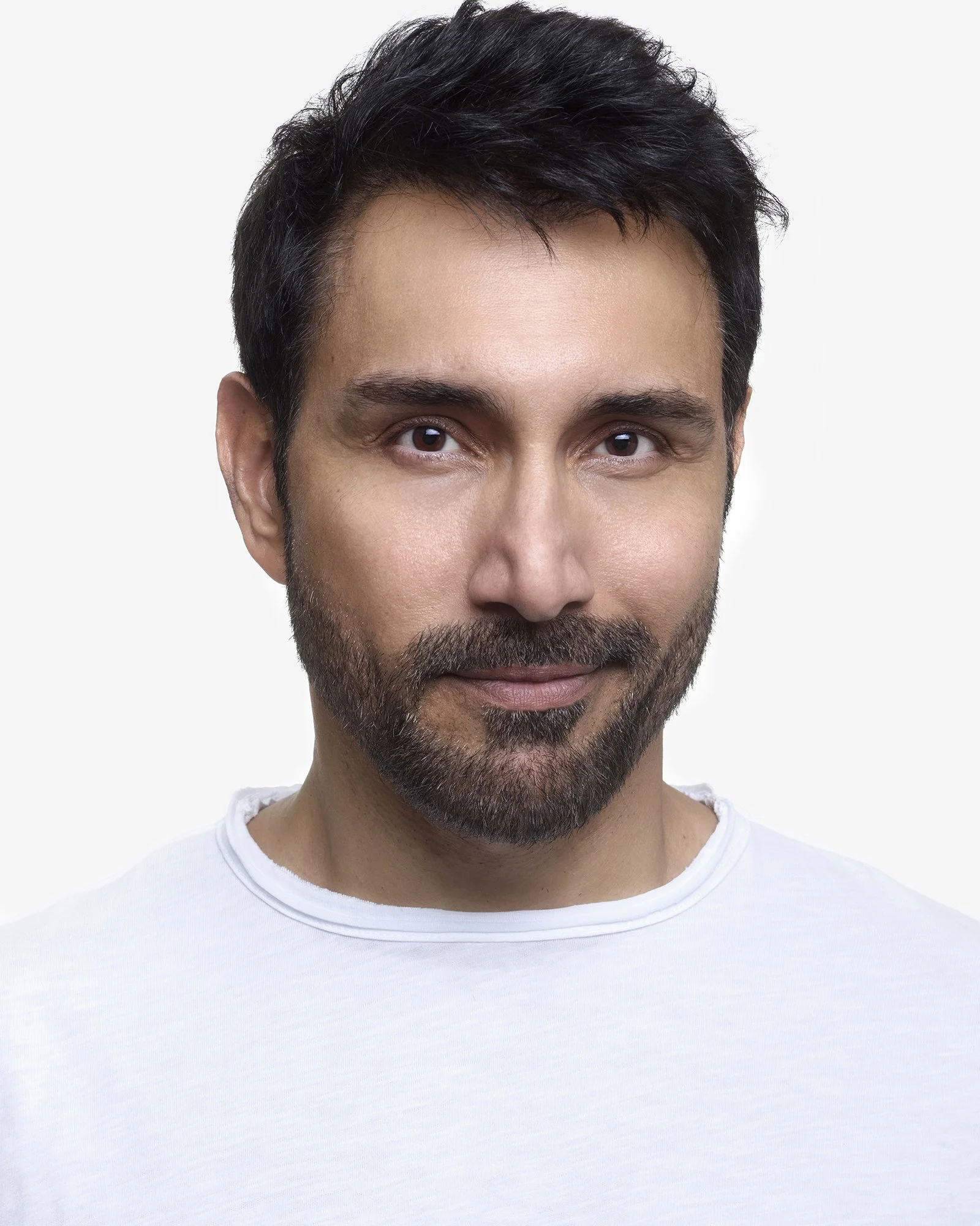 Headshot of actor Harry. Harry is a male with mediterranean appearance with brown/black hair. He is aged between 30-40 years old