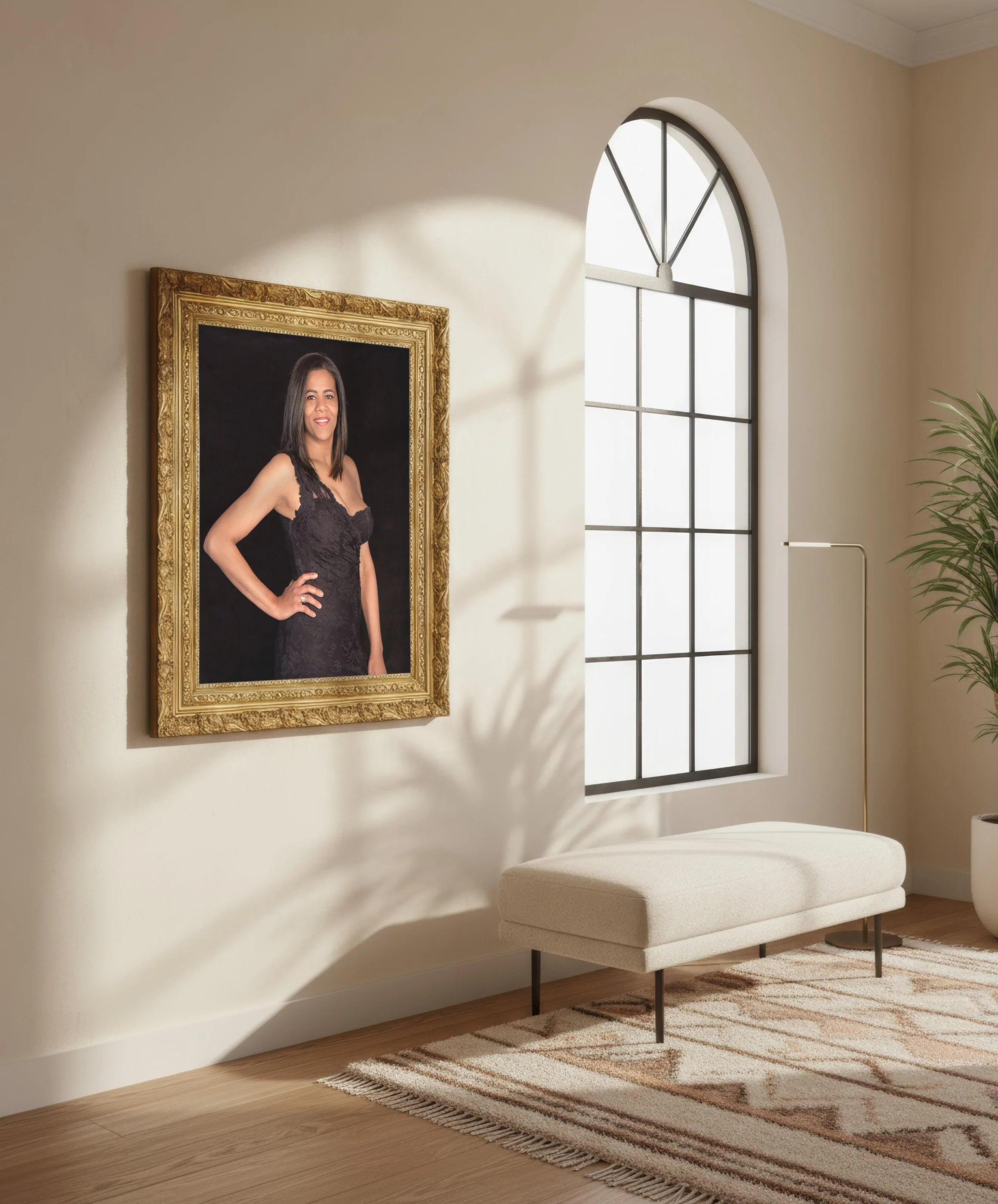 Living room with a large window, a modern white upholstered bench, a patterned rug, a potted plant, and a framed photograph of a woman in a black dress.